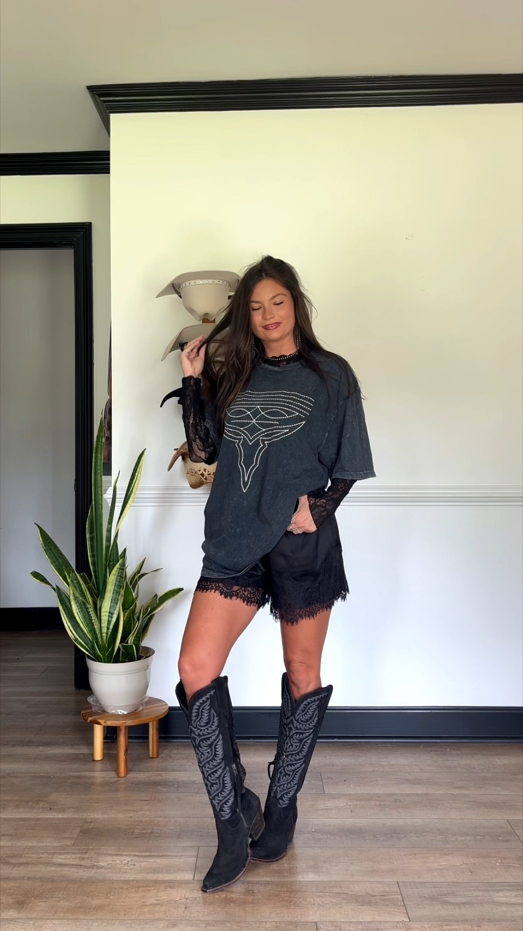 Edgy western look using graphic tee with lace layered underneath! Wearing large tee, xs lace long sleeve, and medium shorts (they run small) boots have sold out multiple times!

#LTKootd #LTKgrwm #LTKSeasonal