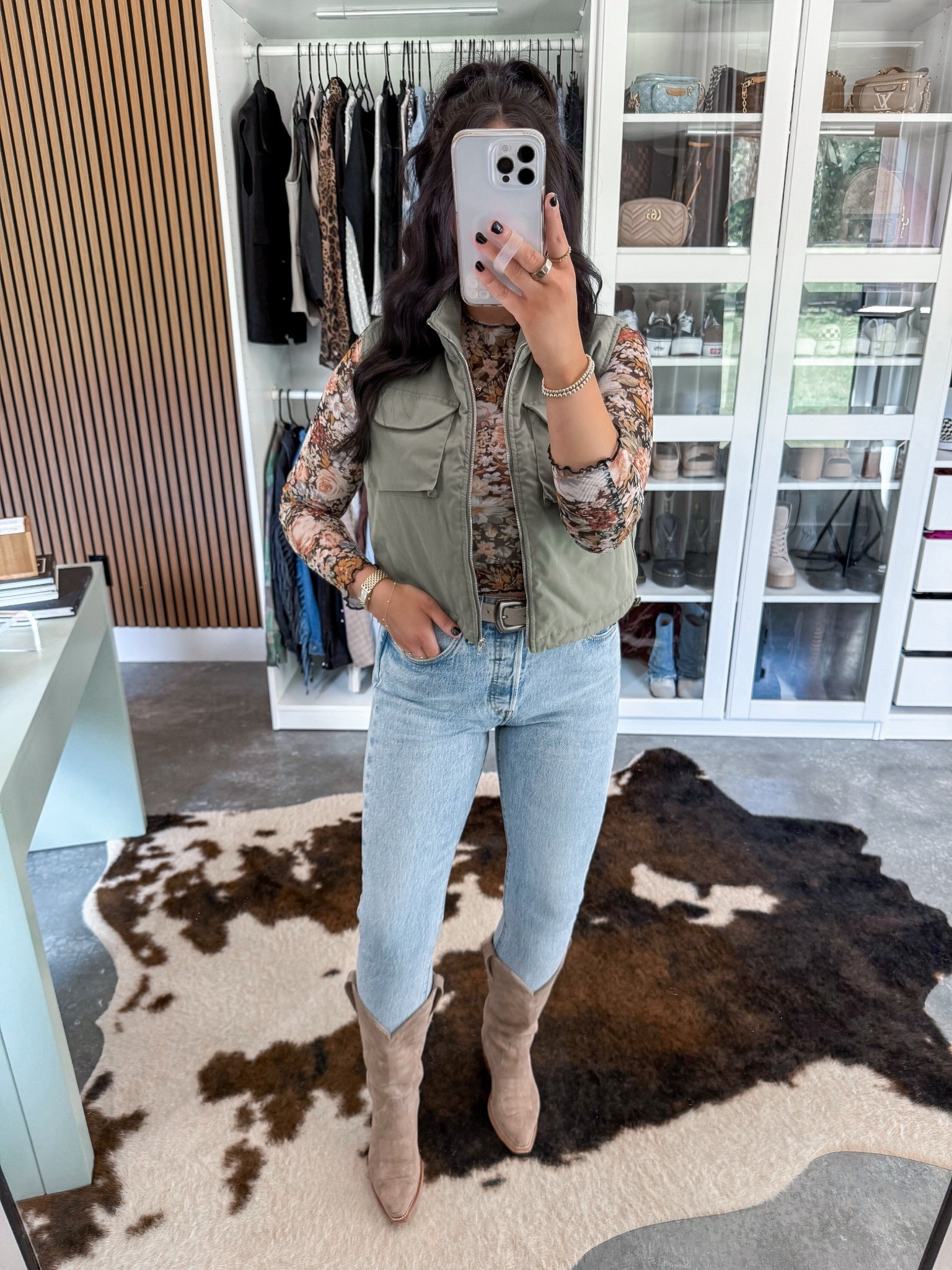 Casual Fall Western Outfit 🍁

Top — small (multi floral option)
Vest — small (army green option)
Jeans — 27 (tango light option)
Belt — small
Bralette — medium 

Cowgirl boots outfit, but make it casual 👏🏼 love them paired with these Levi’s skinny jeans! Added this mesh floral long sleeve top (wore a nude bralette underneath since it is sheer!) & added this army green vest & my western belt to complete the look! 🤍

#LTKFindsUnder100 #LTKShoeCrush #LTKFindsUnder50