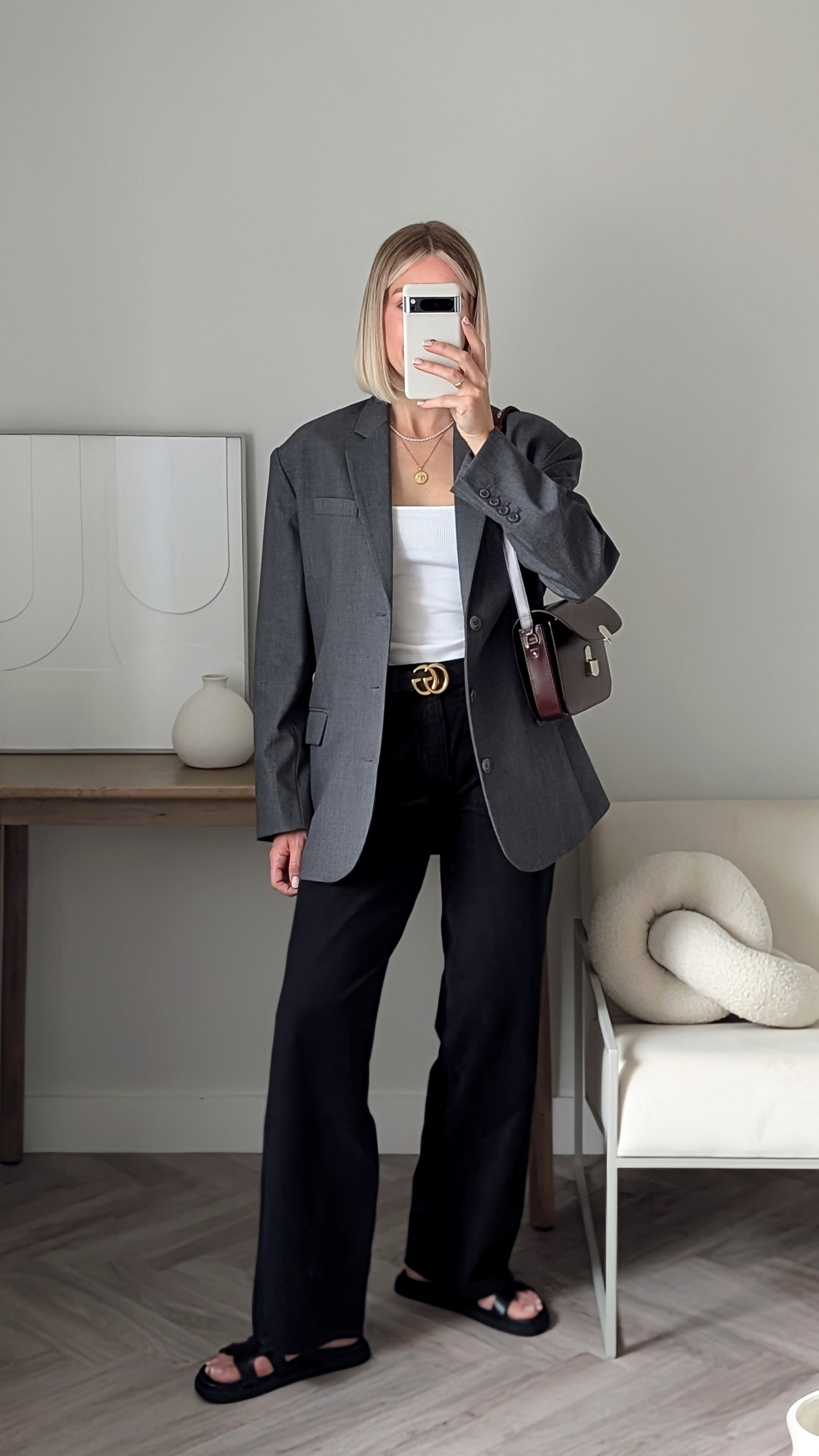 Grey oversized blazerWhite tank topAgolde black wide leg jeans (on sale)Gucci beltHermes Chypre dupe sandals Sezane burgundy leather bag 

#LTKsale #LTKuk #LTKeurope