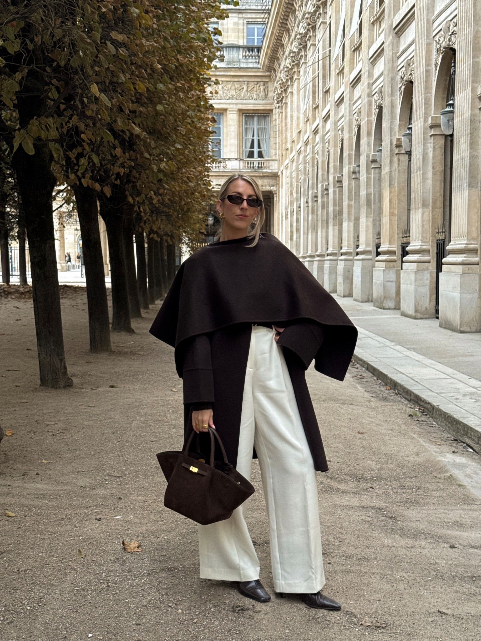 Brown cape jacket with white wide leg trousers 🍂 I wear a size 36 in the jacket and a 8 in the trousers 

Suede bag, demellier, wool coat, brown coat, white trousers, autumn outfits, Paris outfits 

#LTKstyletip #LTKwinter #LTKautumn