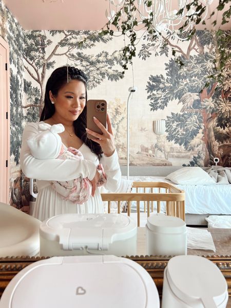 Baby girl nursery with a mural wallpaper, daybed and dresser. Also linking baby girl’s ruffle butt footie, similar bow baby hat, maternity dress that’s been great postpartum for me and all of her diaper changing items. 

#LTKbaby #LTKfamily #LTKstyletip