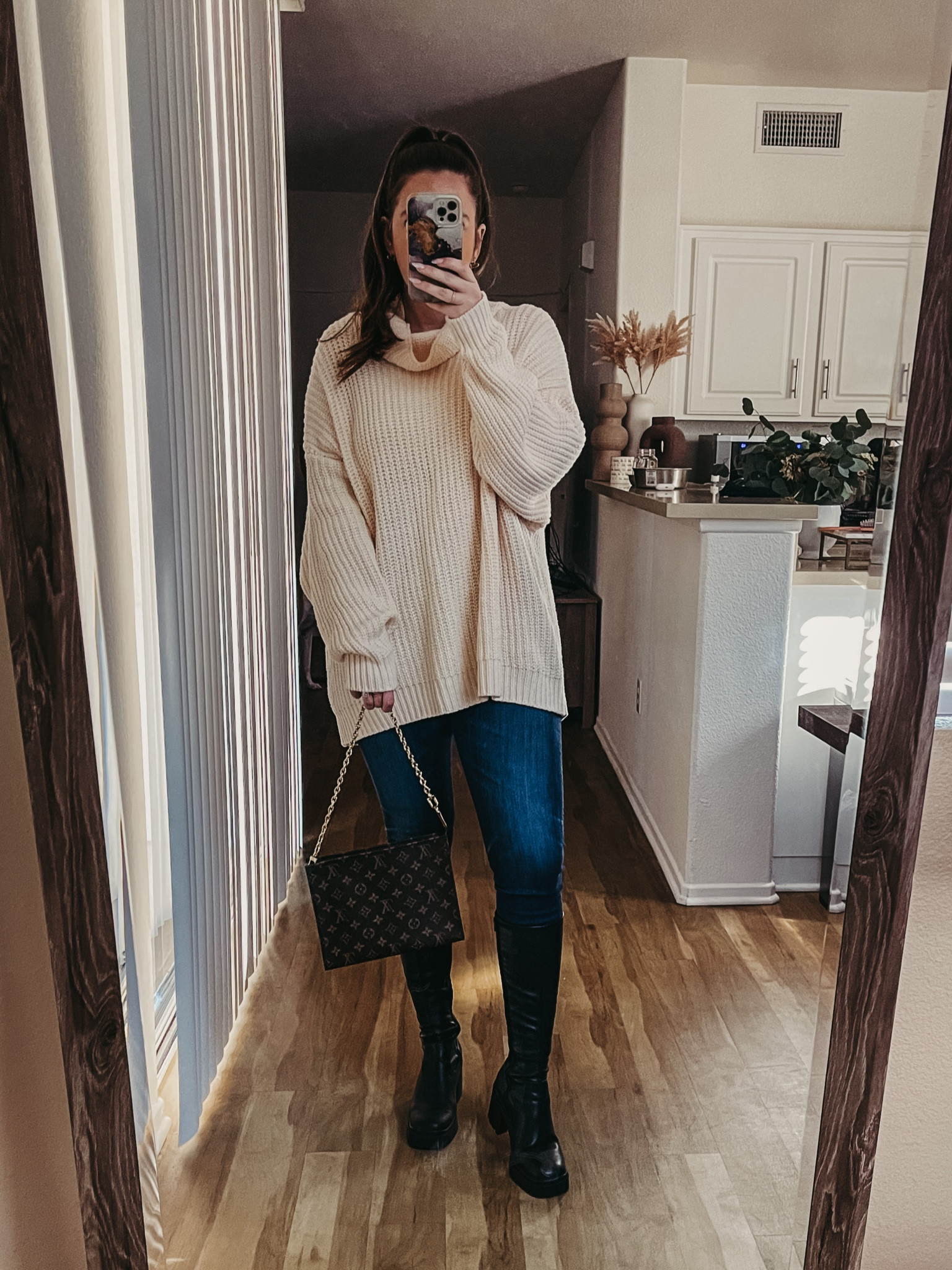 Free people sweater turtleneck sweater ag denim jeans Steve Madden boots Louis Vuitton toiletry on chain 

#LTKSeasonal #LTKstyletip #LTKitbag