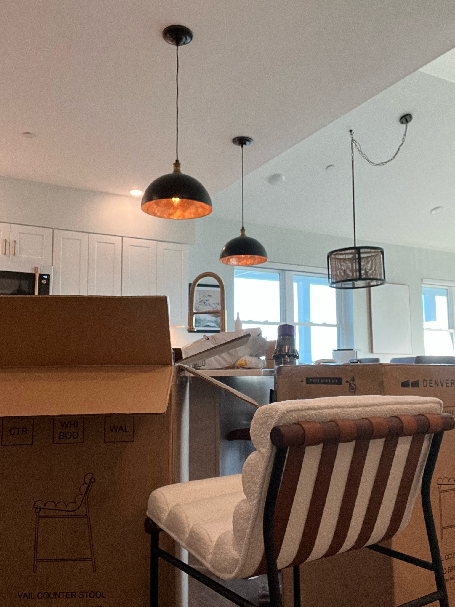 My new bar stools from Denver modern arrived to finish off our kitchen makeover! Linking similar stools (basically exact) from wayfair along with our bronze brass shell pendant lights and gold faucet and cabinet handles - literally my dream white beach kitchen! 

#LTKFind #LTKhome #LTKstyletip