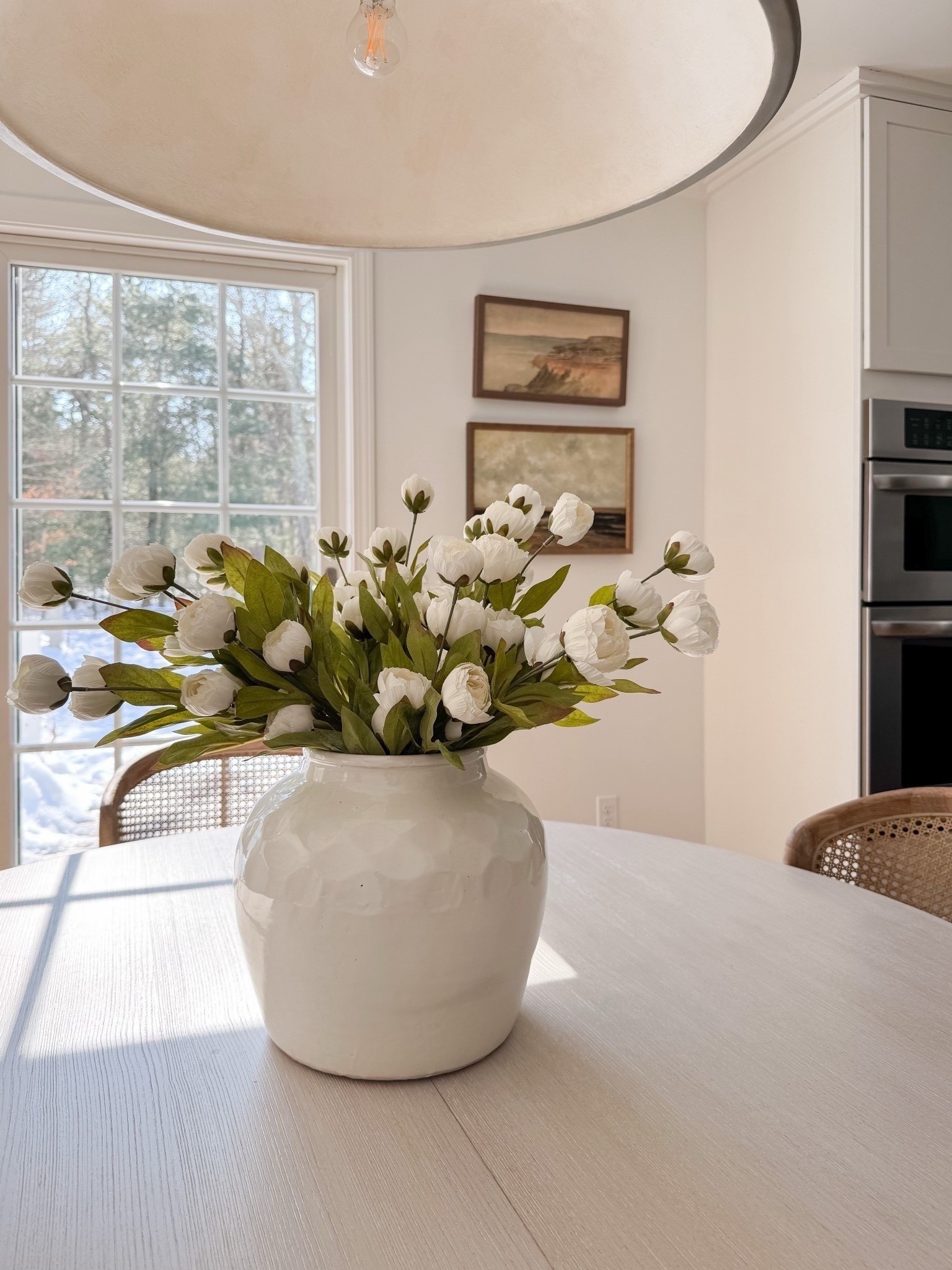 Love this little sight of spring 🤍 If anything, some faux florals in a vase are enough to refresh your space. I found a great dupe for this white ceramic vase, which is such a great price! 

#LTKSeasonal #LTKSaleAlert #LTKHome