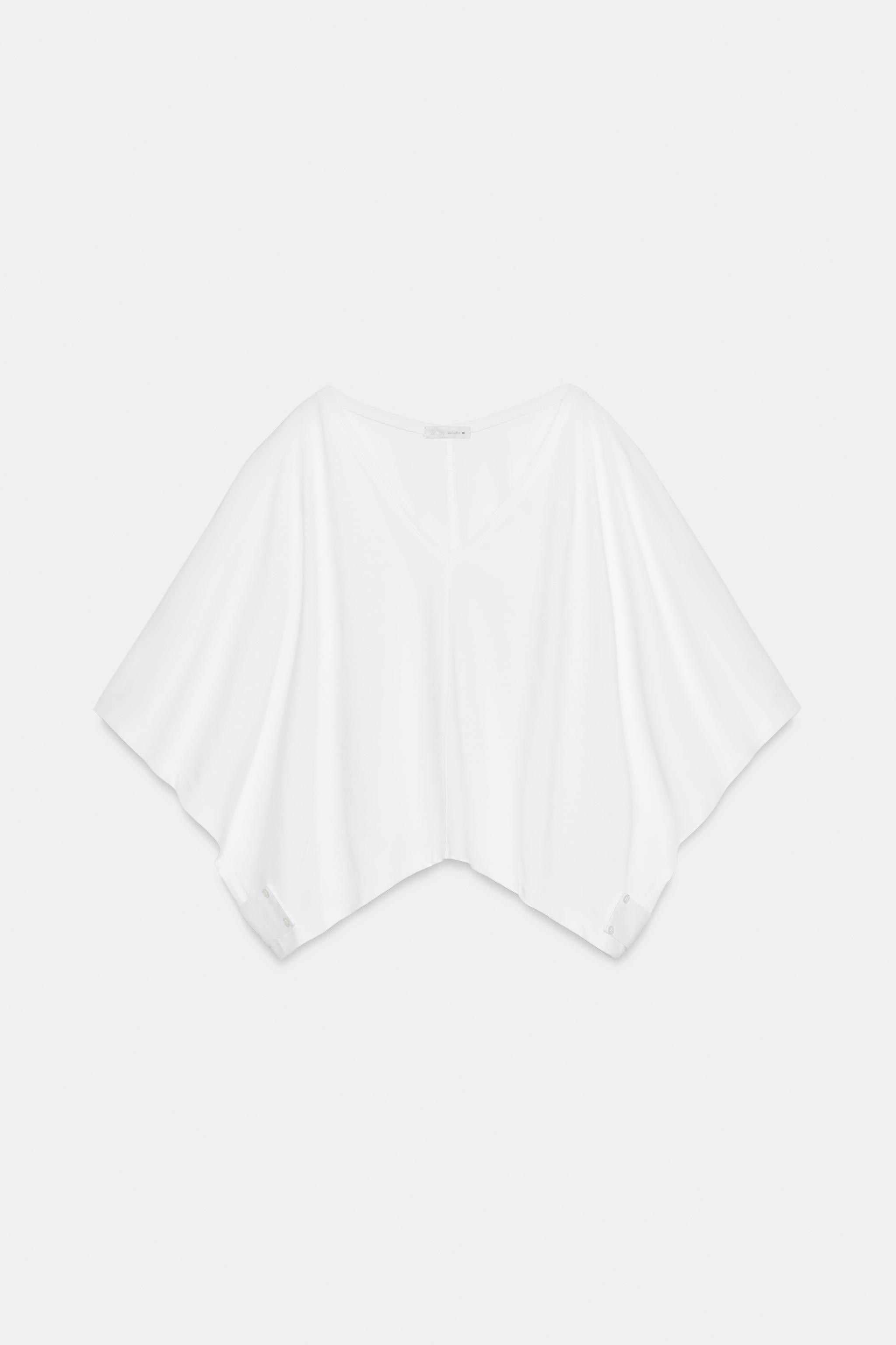 Model height: 180 cmT-shirt crafted from cotton yarn. Features a V-neck, short cape-style sleeves... | Zara Canada