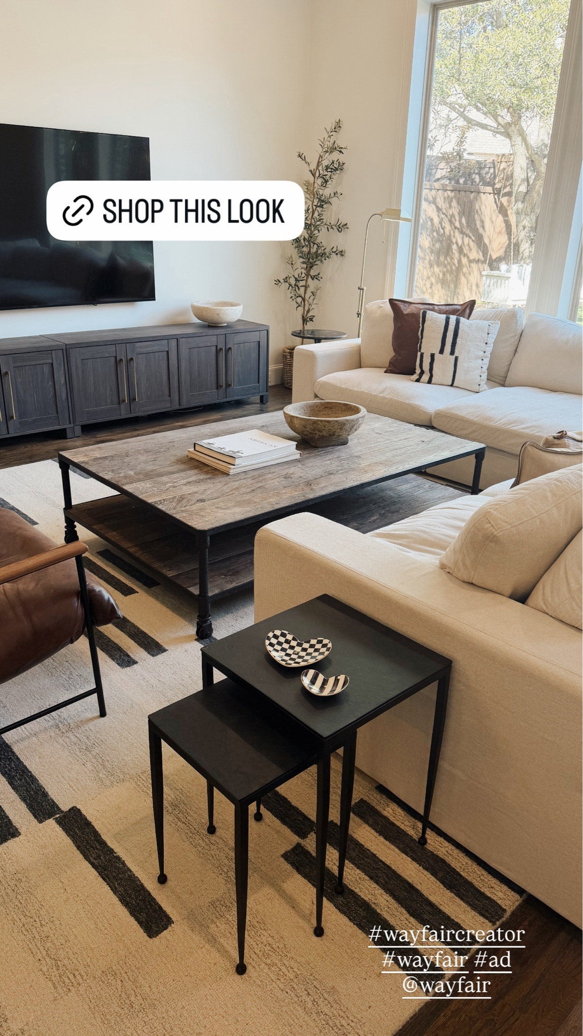 Neutral living room decor that feels cozy, elevated, and timeless. I love the mix of warm wood tones, creamy furniture, black accents, and layered textures throughout this space. Such a good example of how to make a living room feel high end while still being comfortable and family friendly.

#LTKSeasonal #LTKHome