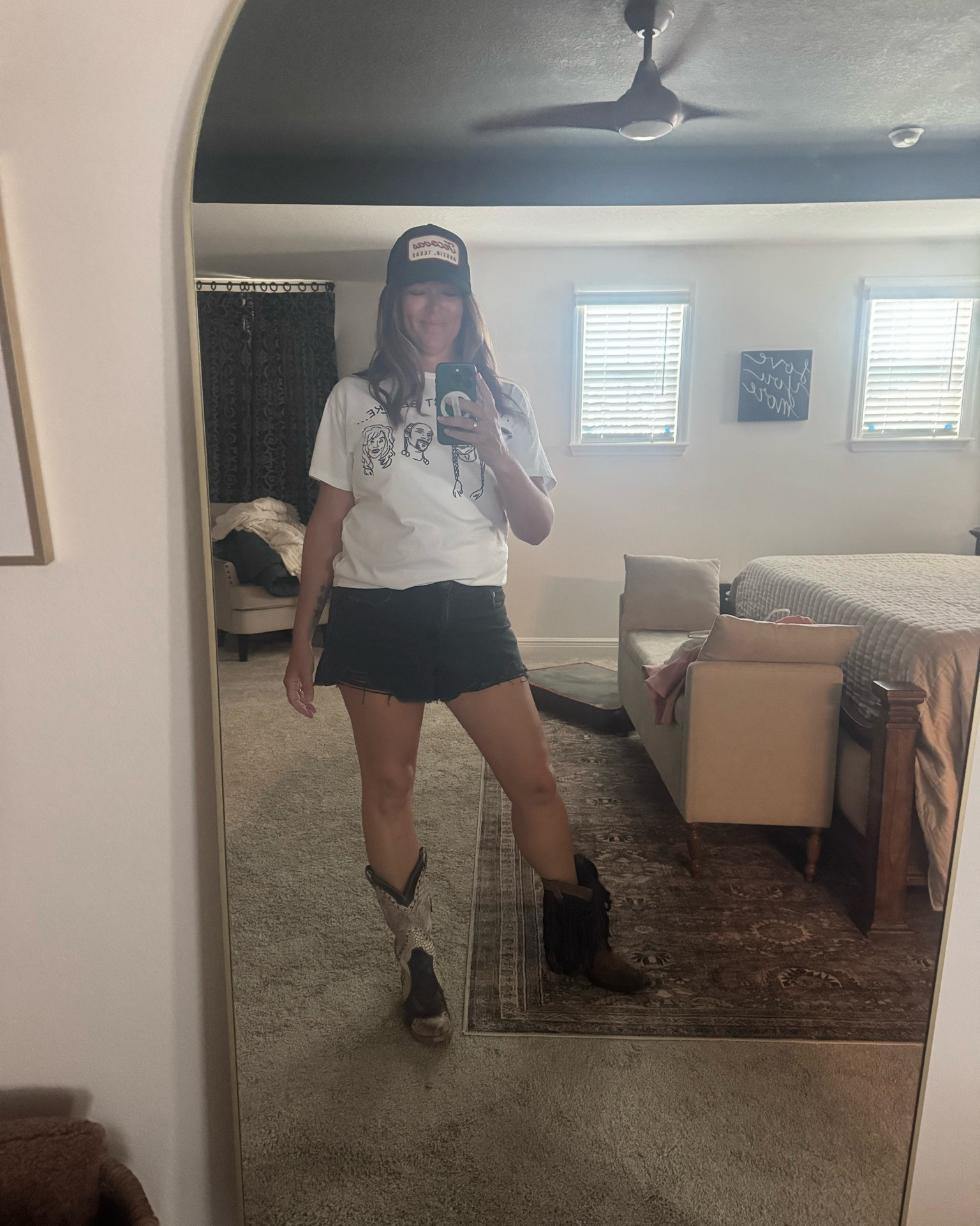 For every country concert, you can find me in cut off shorts, a T-shirt, boots and a hat! First step for me is to figure out which boots I’m going to wear so you can see me trying on a couple pairs in this picture.
Then I wear a good country T-shirt in this case it’s the one that says my playlist be like and it shows Post Malone, who I was going to see Willie Nelson, Snoop Dogg, and Dolly Parton 🤠
Keep in mind that I’m 48 years old so these shorts I did get from American Eagle but they’re stretchy you can’t tell they’re stretchy but they’re super comfortable. I have them in back and I also have them in denim for that reason!!
Had to also grab a net back hat and a fan for this heat 🥵
 I’ll link everything I can for your next concert! This was such a fun date night for us. I hope you have a blast!

#LTKMidsize #LTKOver40 #LTKootd