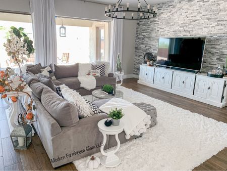 Living room furniture at ModernFarmhouseGlam 
Couch sofa sectional wagon wheel light shag white rug home decor media console table white 

#LTKhome #LTKsalealert