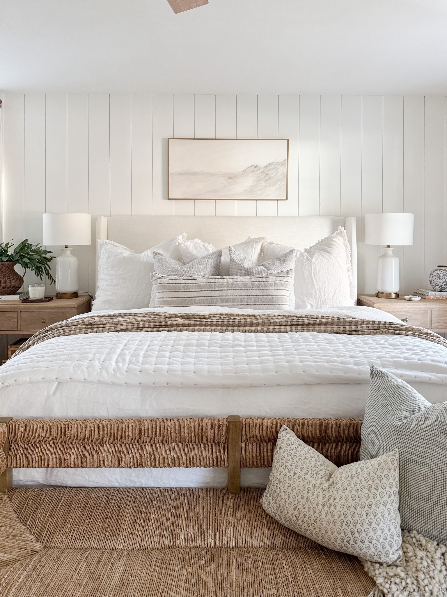 Layered bedding, warm wood tones, and soft textures make this coastal bedroom feel calm and complete. coastal bedroom decor, neutral bedroom, upholstered bed, woven bench, coastal home style, serene bedroom, timeless interiors, bedroom inspiration, sherricalnanhome

#LTKFindsUnder50 #LTKHome