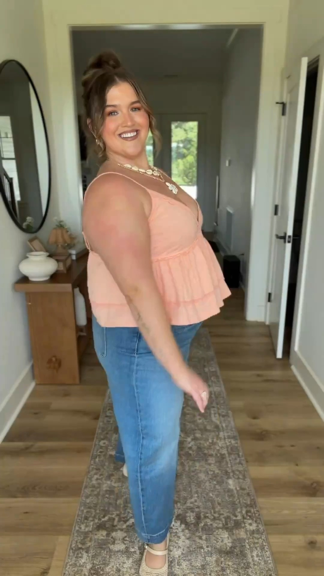 How pretty is the peach 🍑 color of this top?! It’s absolutely beautiful for the summer, and looks so good with these medium wash jeans. These neutral seashell 🐚 accessories complete the look, giving it such a pretty summery, beachy look. 🏝️ 
Casual summer outfit, peach tank top

#LTKPlusSize #LTKSaleAlert #LTKSeasonal