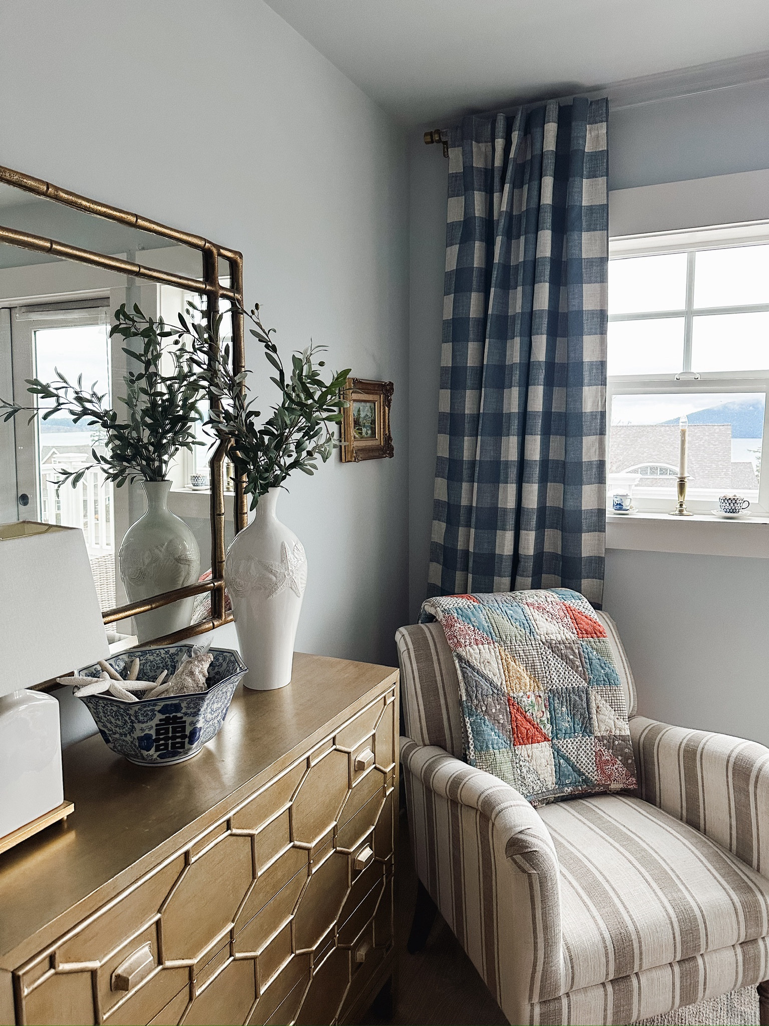 Buffalo check curtains (chambray color, other color options), striped armchair, patchwork quilt, window candles battery operated brass 

#LTKhome #LTKsalealert #LTKstyletip