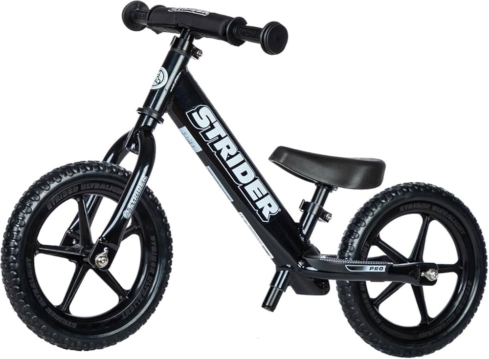 Strider 12” Pro Bike - No Pedal Balance Bicycle for Kids 1 to 4 Years - Includes Safety Pad, Pa... | Amazon (US)
