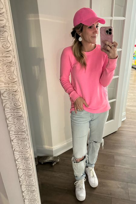 Catch me in my mom uniform. How bout dat 🤣😎 I can’t get enough of the pieces here. I own this sweatshirt/pullover in multiple colors - the side zippers change the fit to be more fitted or more loose and casual: I like to size up one size. These jeans are so comfortable, relaxed fit but still so cute. Pink athletic hat means not so sweaty once it get hot. Finishing off the look with my most comfortable white sneaker. Grab the top, hat and jeans while their on sale now

#LTKsalealert #LTKSpringSale #LTKGiftGuide