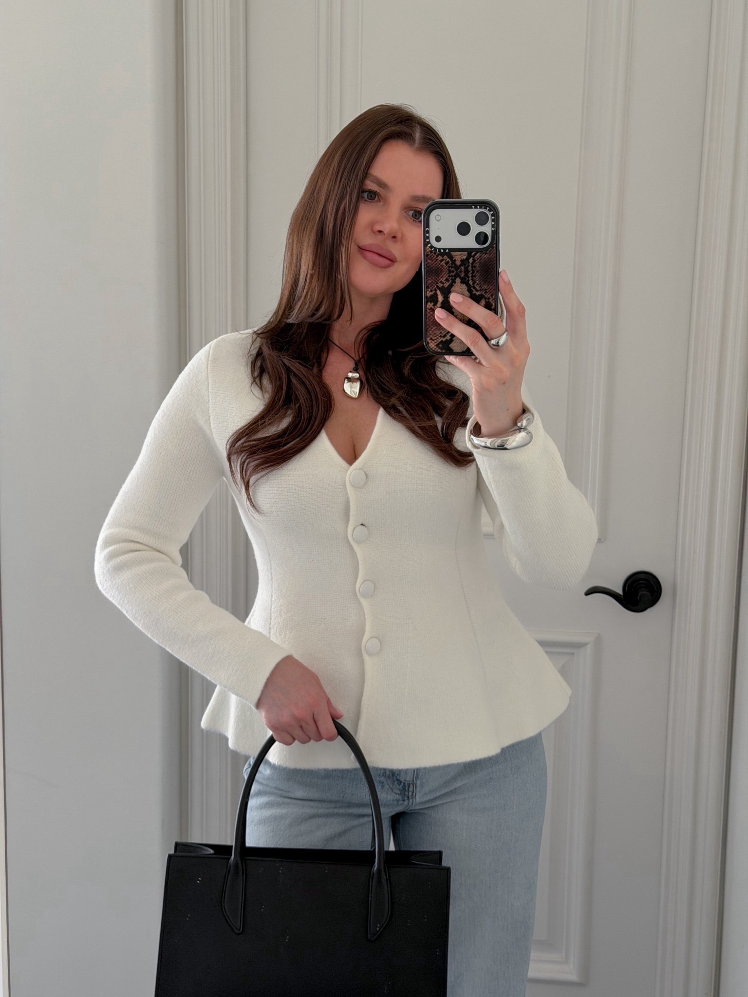 Styling white structured sweater with wide leg jeans, black sling backs and a black mini tote. Adding silver jewelry to elevate the look. This sweater is perfect for the office or a casual brunch date. Wearing size S. Fits true to size 
#sweater #strucktured #workwear #officeoutfit #springoutfit #brunchoutfit 

#LTKootd #LTKWorkwear #LTKgrwm