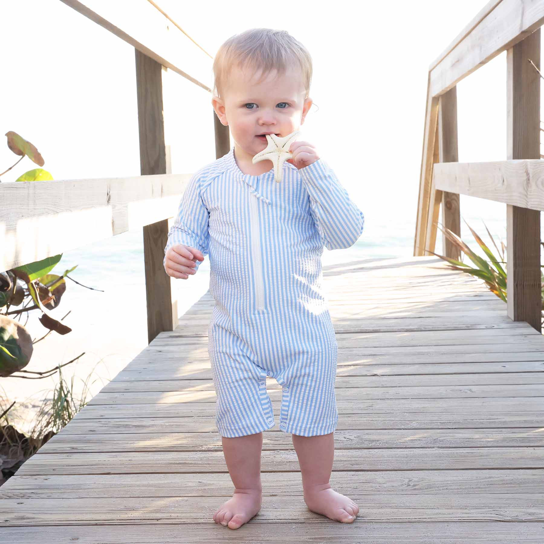 Long Sleeve Rash Guard Swim Romper Shortie | Seersucker Blue | Caden Lane