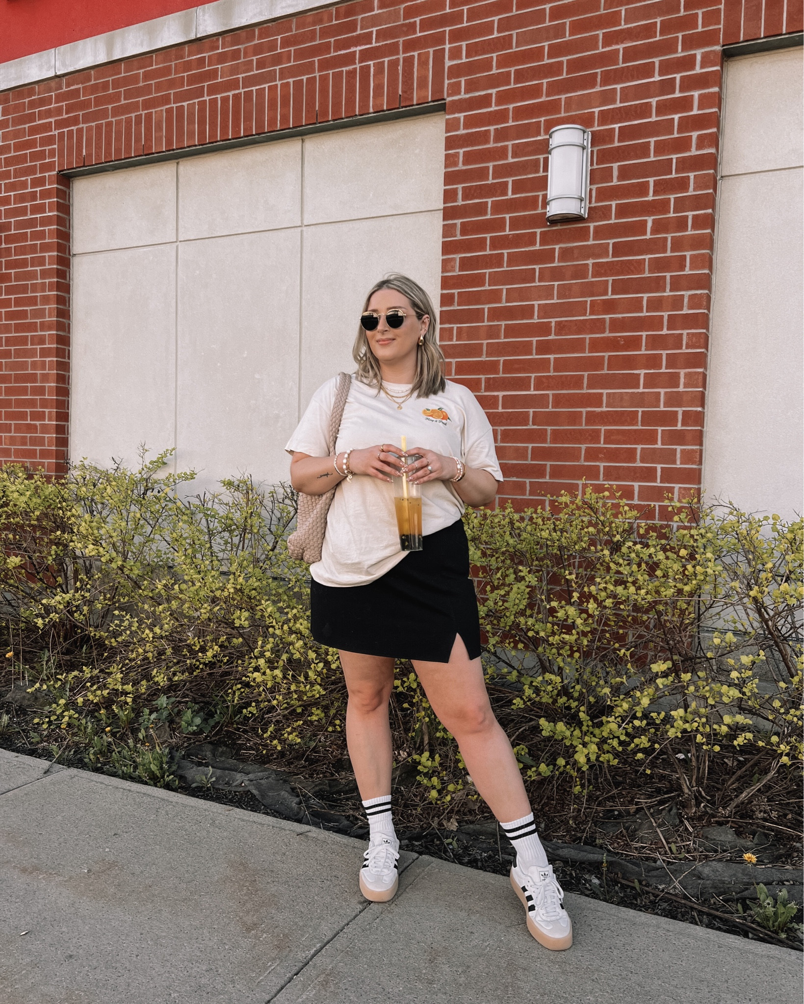 Casual midsize spring to summer outfit - oversized graphic tee (size L), black mini skirt (linked similar), adidas sambas


#LTKstyletip #LTKcanada #LTKmidsize