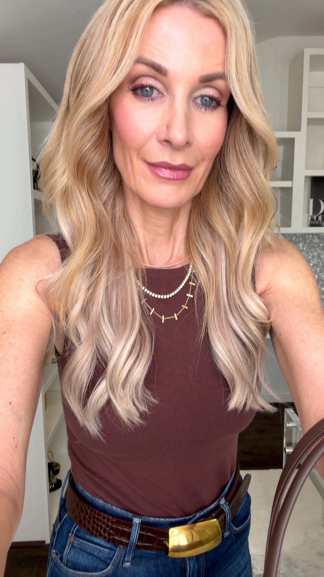The perfect polished fall outfit starts with a chic burgundy tee and flattering high-rise jeans! I added a statement belt and neutral bag for an effortless look that works for lunch, errands, or date night. I’m wearing an XS in the tee and a size 24 in the jeans. #LTKOver40 #LTKootd #FallOutfit #DenimStyle 

 #LTKootd #LTKSeasonal #LTKOver40