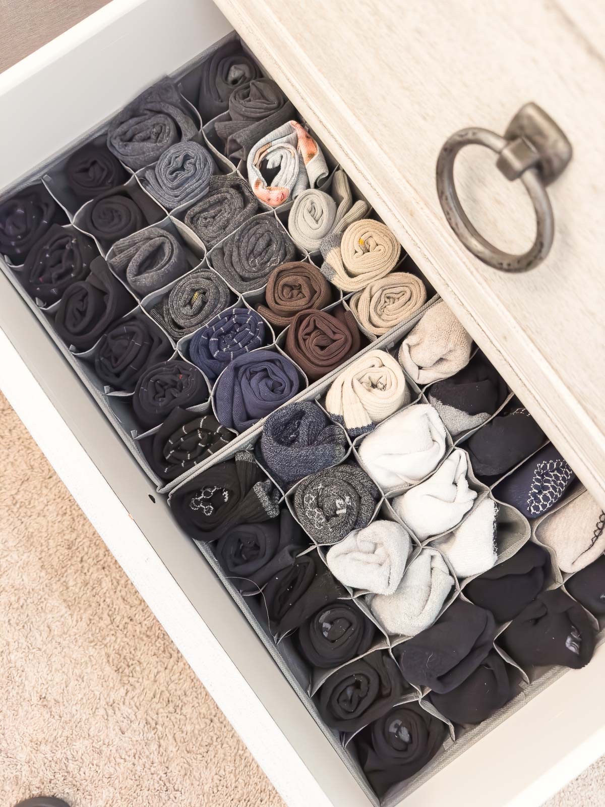 It only takes a few key items and methods to organize all of your dresser drawers and to keep them organized. These cell organizer boxes are perfect for holding socks, under garments and more. I also use drawer dividers to separate larger items that I fold and roll to a precise fit in the dresser drawers. wide dresser bedroom organization home organization dresser drawer organization home storage 

#LTKStyleTip 

#LTKHome #LTKFindsUnder50