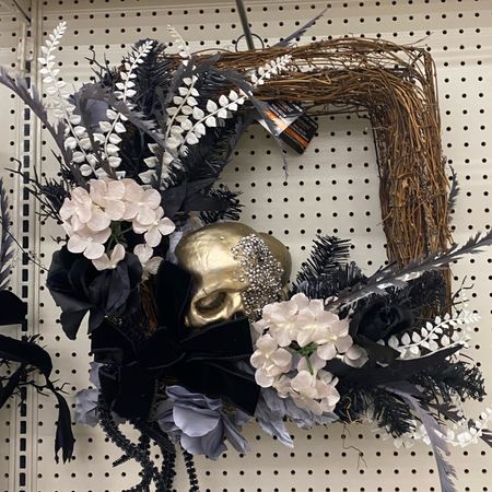 Hit the right mix of spooky and enchanting in your Halloween décor with this unique square frame wreath from Ashland. An arrangement of roses and dark foliage enveloping a shimmery skull, let this piece bring haunting charm to your front door as you celebrate the tricks and treats of the season.

Details:
Black and white
22" x 6" x 24" (55.8cm x 15.24cm x 60.9cm)
Polyester, foam, twig, iron wire and PVC
Recommended for indoor and covered outdoor use only

#LTKtravel #LTKfindsunder100 #LTKsalealert