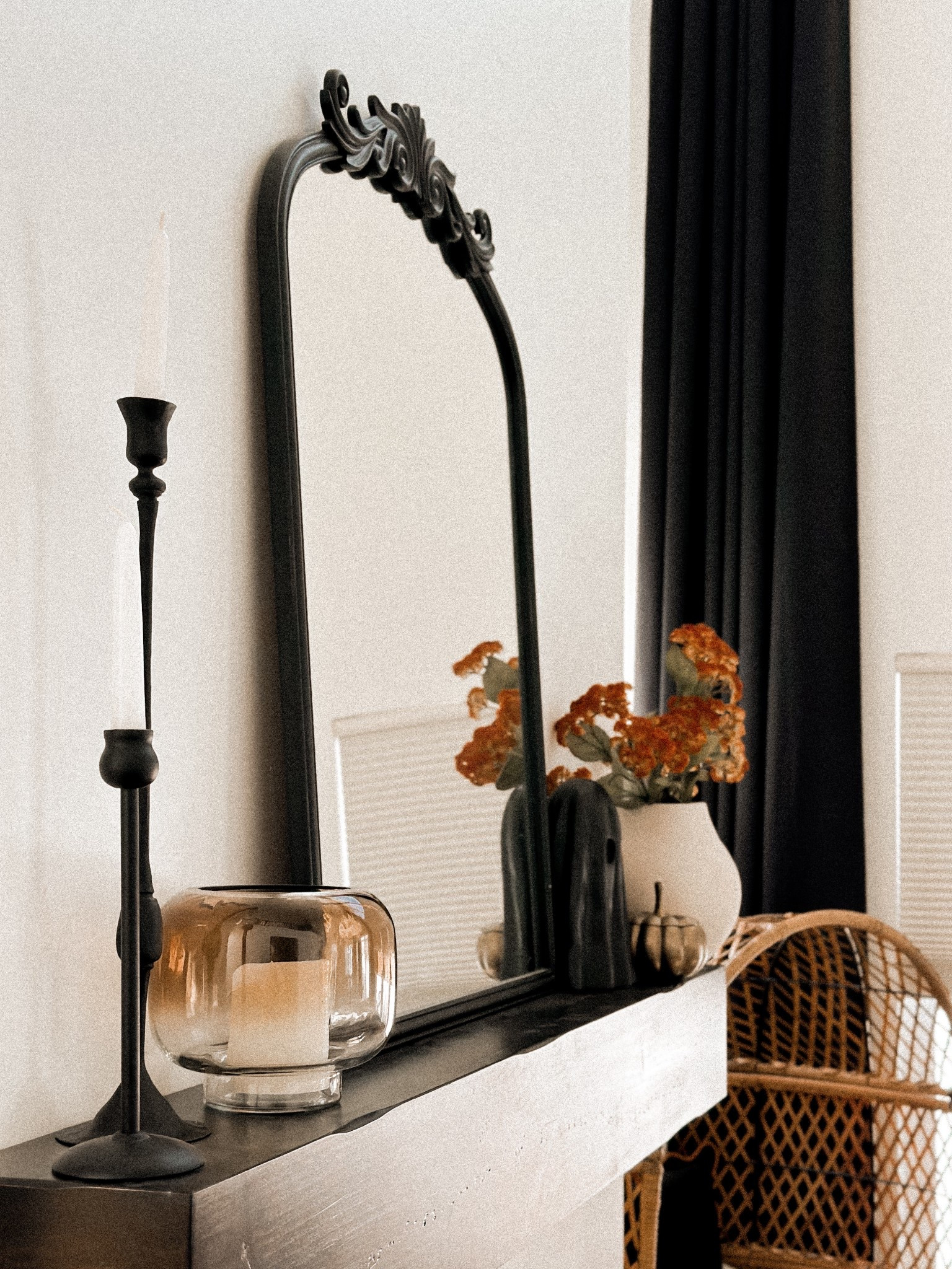 Cozy Modern Fireplace Styling:
This mantel setup is giving me all the warm + moody vibes for fall 🍂🖤. I’ve been itching to decorate for Halloween and am loving the turn out!

Black candlesticks – such a chic way to add height + drama
Arched vintage-style mirror – instantly opens up the room
Neutral vase (which is a favorite of mine) with the prettiest fall florals – the perfect pop of earthy color
Smoked glass candle holder – obsessed with the soft glow it gives at night
Black Ghost and gold pumpkin - perfect Halloween addition and both are favorites from last year!

Mixing minimalist decor with a touch of modern vintage keeps this space feeling curated but still super inviting. Perfect for transitioning from summer to fall! 🍁

Shop the look below!

#LTKhome #LTKfall #cozymodernhome #manteldecor #modernvintage #neutraldecor #moodyvibes #homestyling #fallfireplace #vintagearchmirror #halloweendecor #halloween


#LTKSeasonal #LTKFindsUnder50 #LTKHome