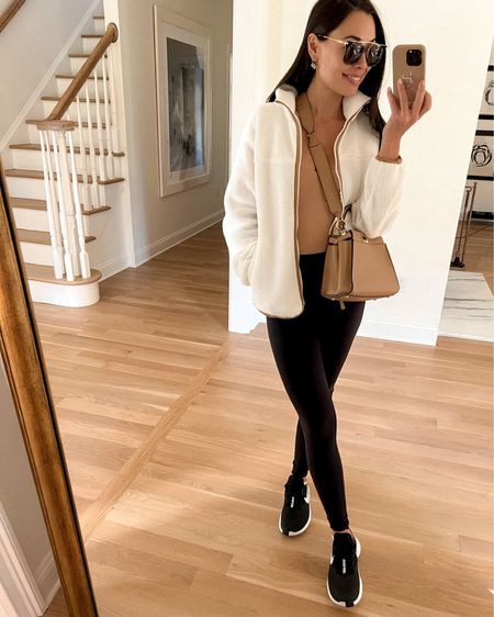 Kat Jamieson of With Love From Kat wears a cozy fleece Sherpa jacket with leggings and sneakers for a causal look. 

#LTKSeasonal #LTKtravel #LTKfit