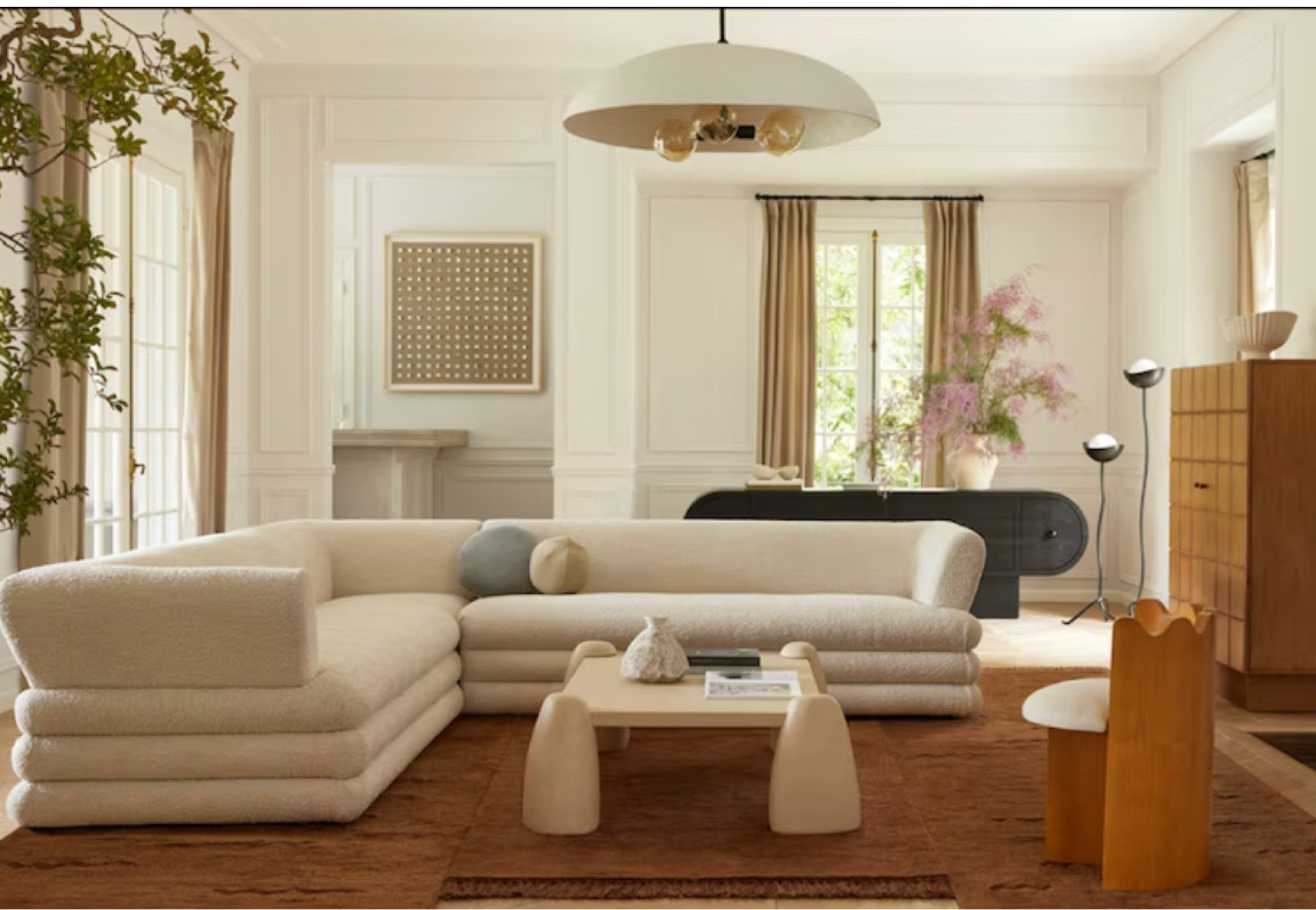 Sarah Sherman Samuel is back with a fresh collection for Lulu and Georgia. In her fall line, Sarah introduces new furniture, rugs and decor, as well as her first-ever lighting and bedding collections. We always love her modern yet warm and playful style. This earthy-toned living room is perfect for your fall refresh inspiration. The sculptural furniture pieces make a bold statement while an irregular shaped rug anchors the room in a playful way. The organic white plaster pendent brings in a relaxing vibe. 



#LTKSeasonal #LTKfamily #LTKhome