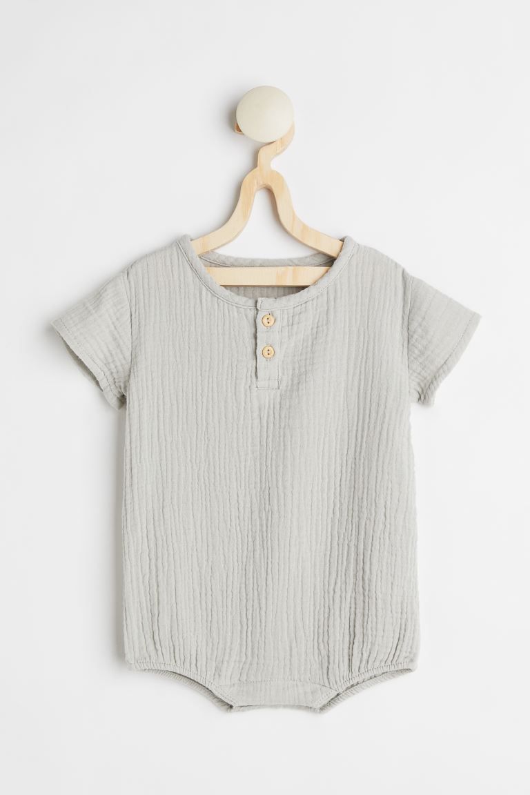 Baby Exclusive. Romper suit in textured double-weave cotton fabric. Decorative buttons at top, sh... | H&M (US + CA)