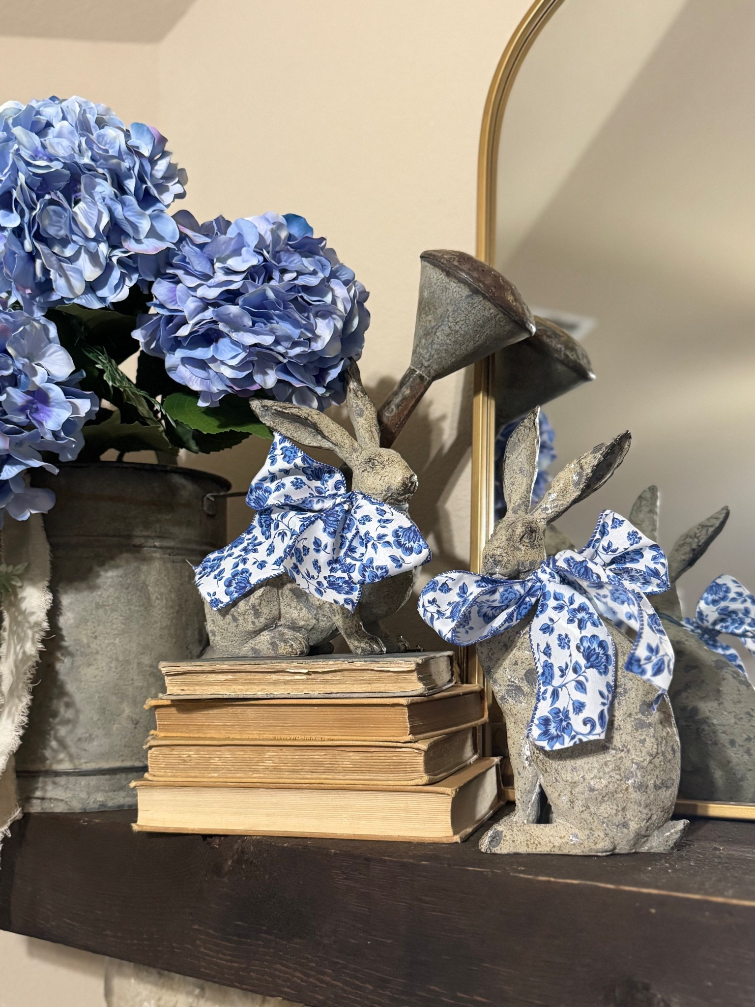 STOP scrolling if you love cottage style Easter decor 🐇💙

This set of bunnies might be the cutest spring find I’ve styled this year. The vintage stone look + toile bows give them that cozy English cottage / farmhouse feel that makes a space instantly feel ready for spring.

I styled them with antique books and blue hydrangeas for that layered cottage look we all love.

If you’re decorating for Easter or just love soft blue & white home decor, these little bunnies are the sweetest statement pieces.

Tap to shop the bunny decor before they hop away 🐇

#easterdecor #springdecor #farmhousedecor #cottagedecor 

#LTKSpringSale #LTKHome #LTKSeasonal