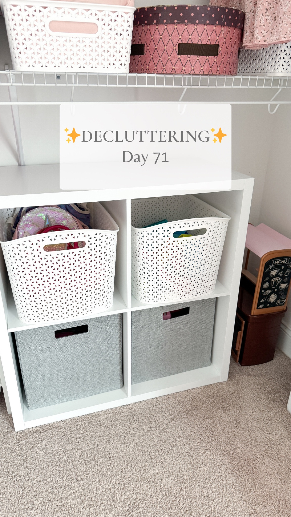 Decluttered part of Emily’s closet and added a cube shelf for storage 