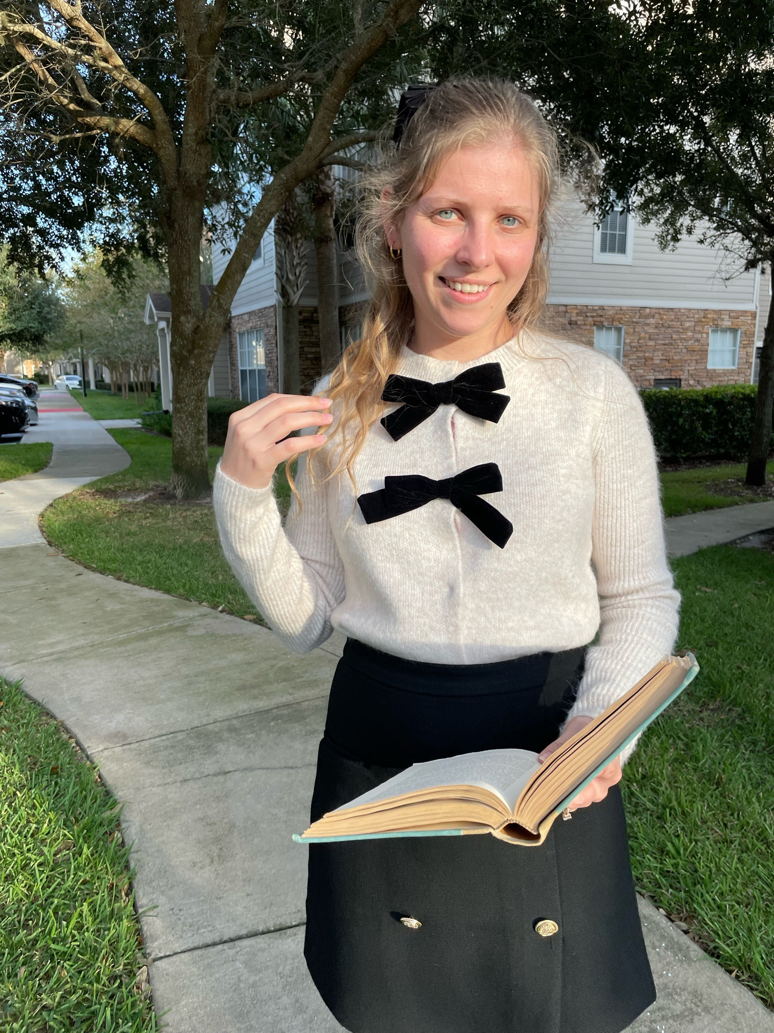 Bow cardigan and double breasted button black skirt  

#LTKSeasonal