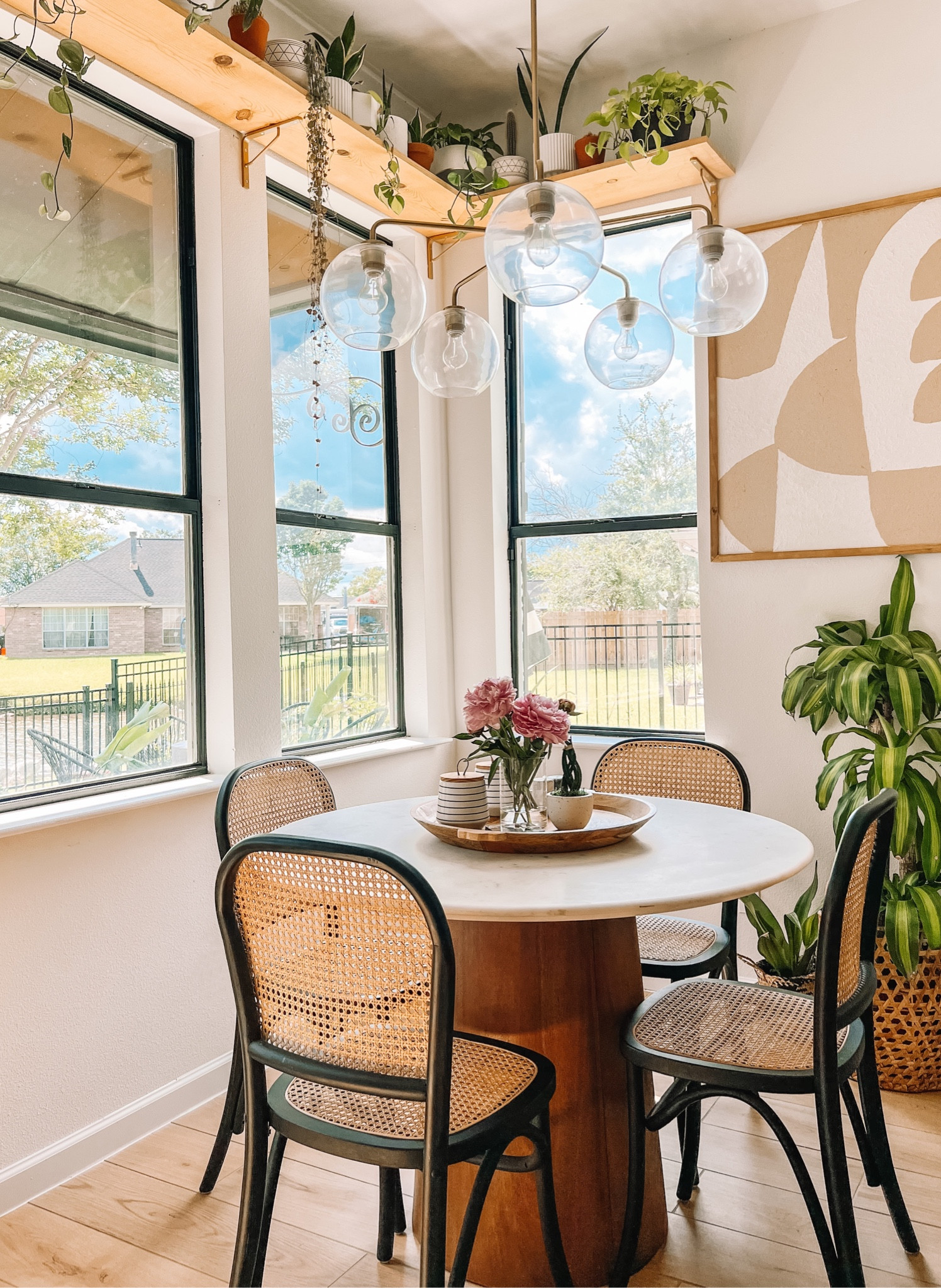 Simple, neutral kitchen nook ~ love all of the natural light + pops of green. 
Linking my cane + black chairs along why the stools that match. 

#wayfair #kitcheninspo #homedecor #homeinspo #neutralkitchen

#LTKstyletip #LTKhome