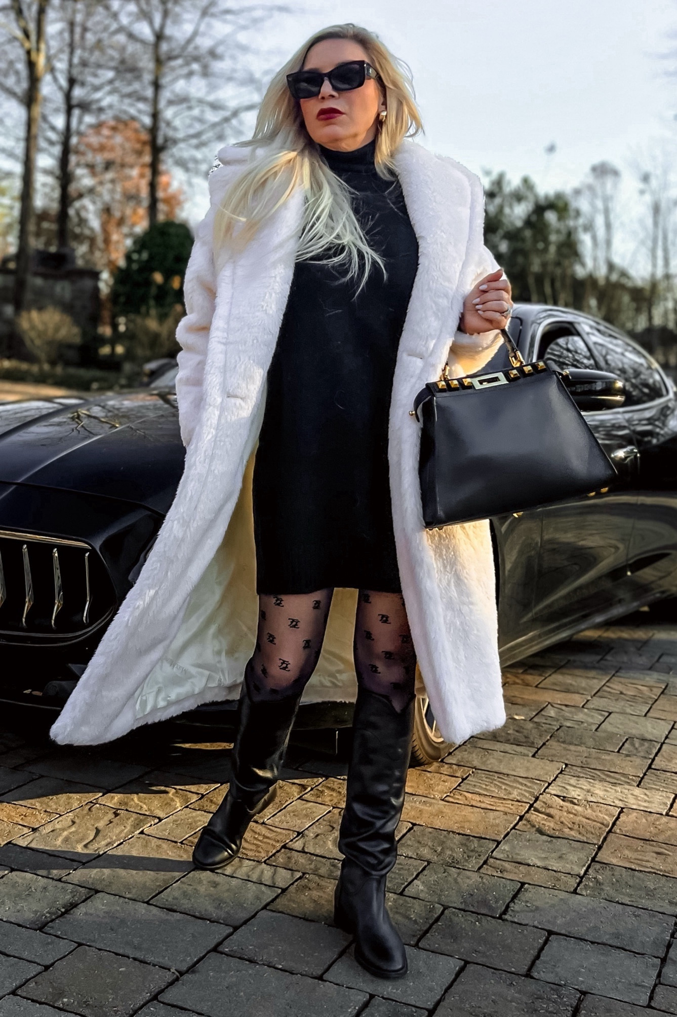 Winter Outfit
Ivory Cream Faux Fur Gertrude Teddy Coat - And yes it is that good! 
Fendi Black Double FF Tights DUPE
Black Notched Knee High Riding Boots ON SALE 25% Off with Code: YULESAVE
Black Turtleneck Long Sleeve Mini Sweater Dress - Wearing a M
Black Fendi Peekaboo Bag - Linking Preowned and good dupes!

#LTKover40 #LTKfindsunder100 #LTKstyletip