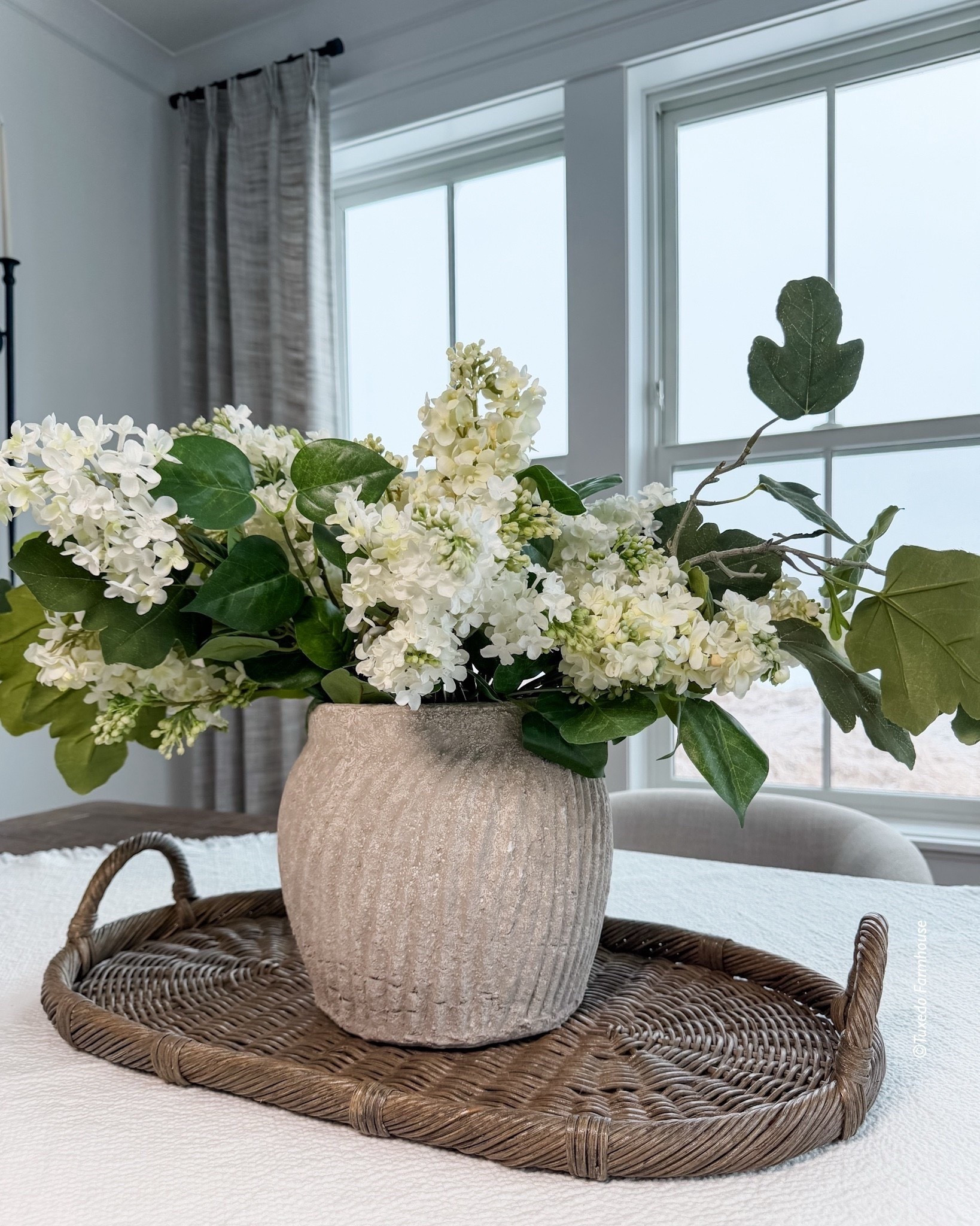 I like to mix ivory and white lilacs to create variation and a more realistic looking arrangement. One of these lilacs is designer and one is Amazon, which makes it more budget friendly. My arrangement is very full with 5 designer and 4 Amazon stems. I also added 3 greenery stems I had. I also found you a few pretty rattan trays. Mine is no longer available. 

#LTKHome #LTKSeasonal

#LTKSaleAlert