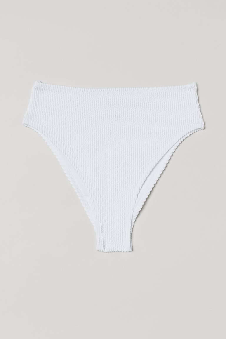 Fully lined, waist-high bikini bottoms with high-cut legs. High-cut at back. | H&M (US + CA)