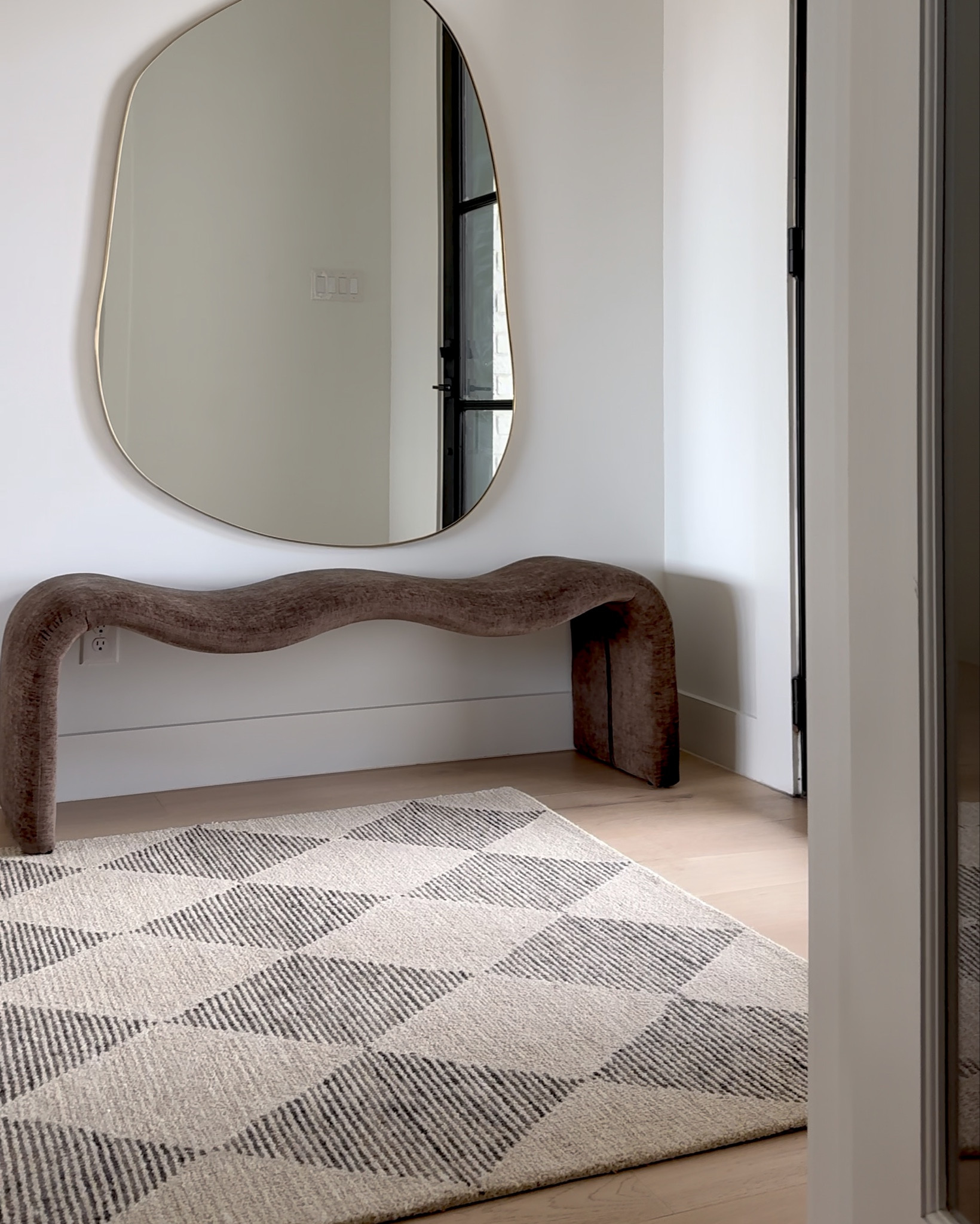 A minimal entry look! Oh & my irregular mirror is on sale rn! 🙌🏻  

#homedecor #neutralhome #bench #rug #mirror

#LTKHome #LTKSaleAlert