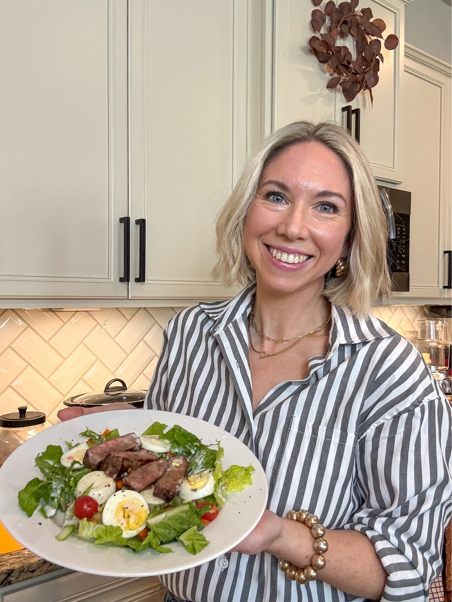 Easy Dinner Idea: Steak and Egg Salad

Start by marinating your strip steak in a glass dish with Worcestershire sauce.  I keep in fridge until I’m ready to cook (taking out of fridge about a 1/2 hour before ready to cook).

I use the egg cooker to hard boil my eggs first.  (When they are done, I place them in an ice bath for 10 minutes before peeling.). 

While eggs are cooking pre-heat the oven to 400 degrees. 

Next place 1-2 tablespoons of oil (usually grape seed oil - though I used olive oil in the video) Turn heat onto medium heat then sear the steak on each side ( I do 2 minutes per side, then 1 minute per side.) before placing in oven to finish cooking for about 8 minutes. Then let steak rest on cutting board for 10 minutes before slicing.

While the steak is in the oven and then resting, chop your veggies, and wash and chop your lettuce ( I like iceberg for this salad but used romaine here because that’s what I had)

Assemble your salad with the lettuce, veggies, chopped hard boiled eggs and sliced steak.  I like to add salt + pepper and some homemade ranch dressing (I mix a ranch packet according to directions but sub yogurt for mayo)

Enjoy!  

Let me know if you have any questions and if you’d like to see more easy recipes like these.  This is a high protein filling veggie filled steak and egg salad that is easy to make!   

I also sometimes serve the kids steak and eggs separately without the salad and give them cut up bell peppers and cucumber or tomato for their vegetable. 

Linking kitchen gadgets below along with some other kitchen favorites of mine. 


Outfit: button down shirt size small
Levis rib cage wide leg jeans: size 26x30
Clogs true to size
Gold necklace 


Kitchen gadgets,  kitchen tools, cooking tools , cooking gadgets , food storage container , glass food storage, Dinner ideas, dinner recipe, easy dinner recipe , easy dinner idea , steak dinner , salad idea, healthy dinner, family dinner, #ltkfamily #ltksalealert

#LTKFindsUnder50 #LTKSaleAlert #LTKHome