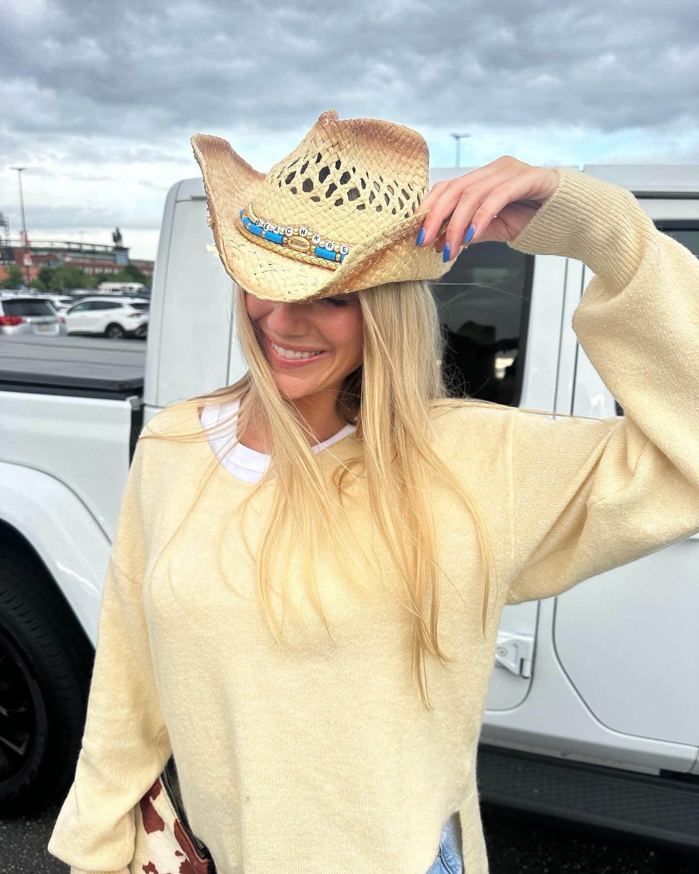 Country concert outfit! Cowgirl hat with denim skirt and yellow sweater  

#LTKFestival #LTKstyletip #LTKfindsunder100