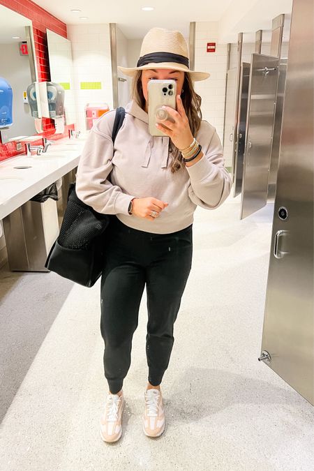 Travel day style. 

The best high waisted joggers with pockets. So lightweight and COMFORTABLE. Wearing a small. 
Target crop ribbed sweatshirt - small
Nike sneakers - run TTS 
My favorite beach hat from Amazon 
Black mesh large beach bag from Target 

#LTKtravel #LTKitbag