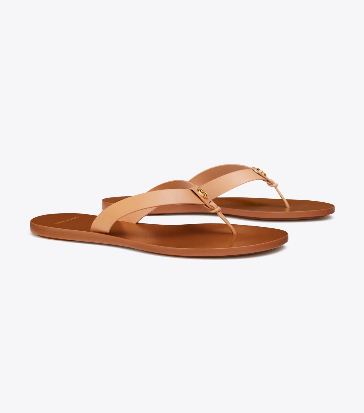 The perfect minimal flip-flop: the Manon Thong Sandal combines wide leather straps that keep the ... | Tory Burch (US)