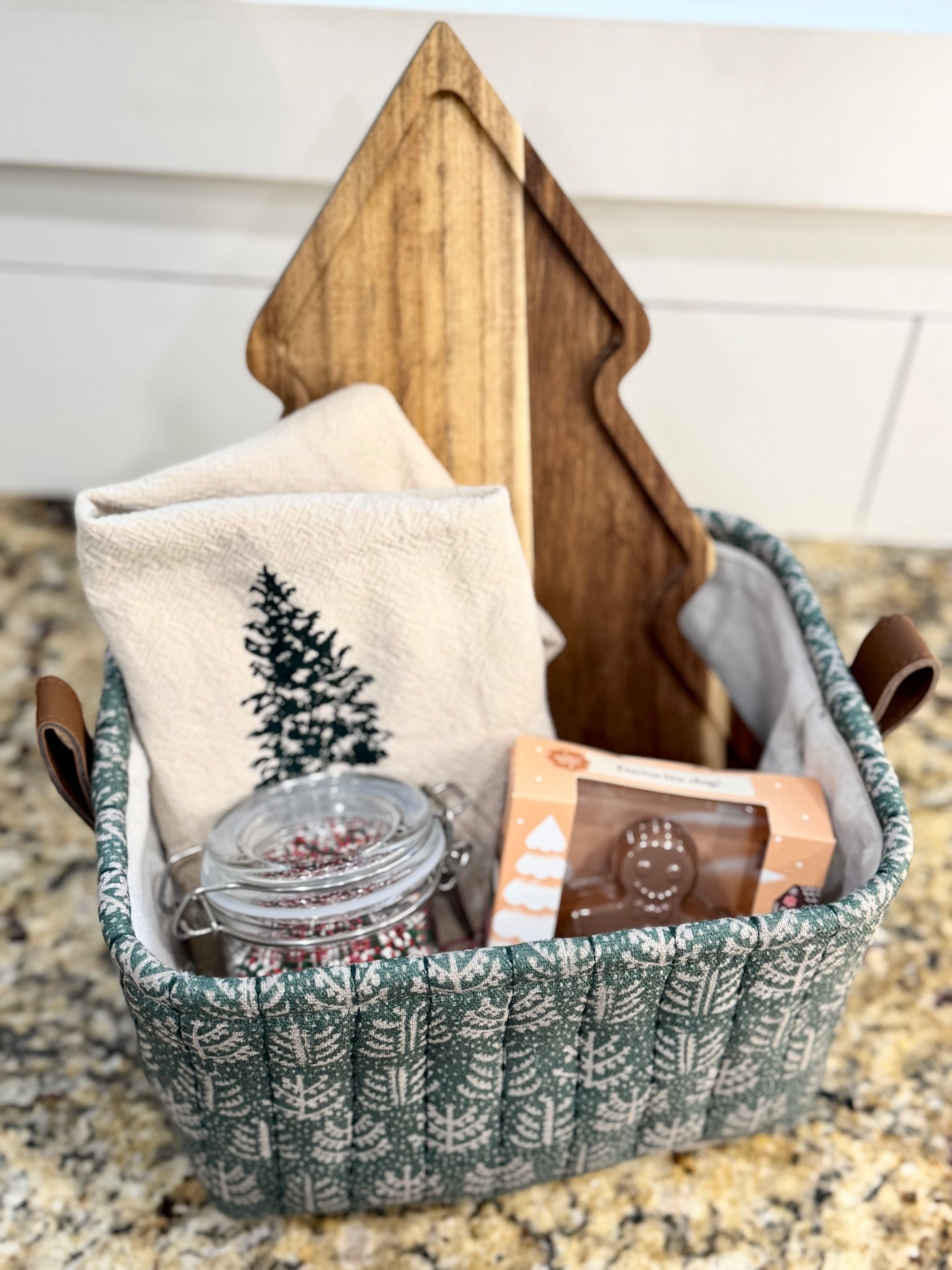 Christmas gift basket, green basket, Christmas tree towel, hearth and hand Christmas towel, Christmas tree cutting board, gingerbread hot cocoa bomb, hot cocoa bar sprinkles

#LTKHoliday #LTKGiftGuide #LTKFindsUnder50