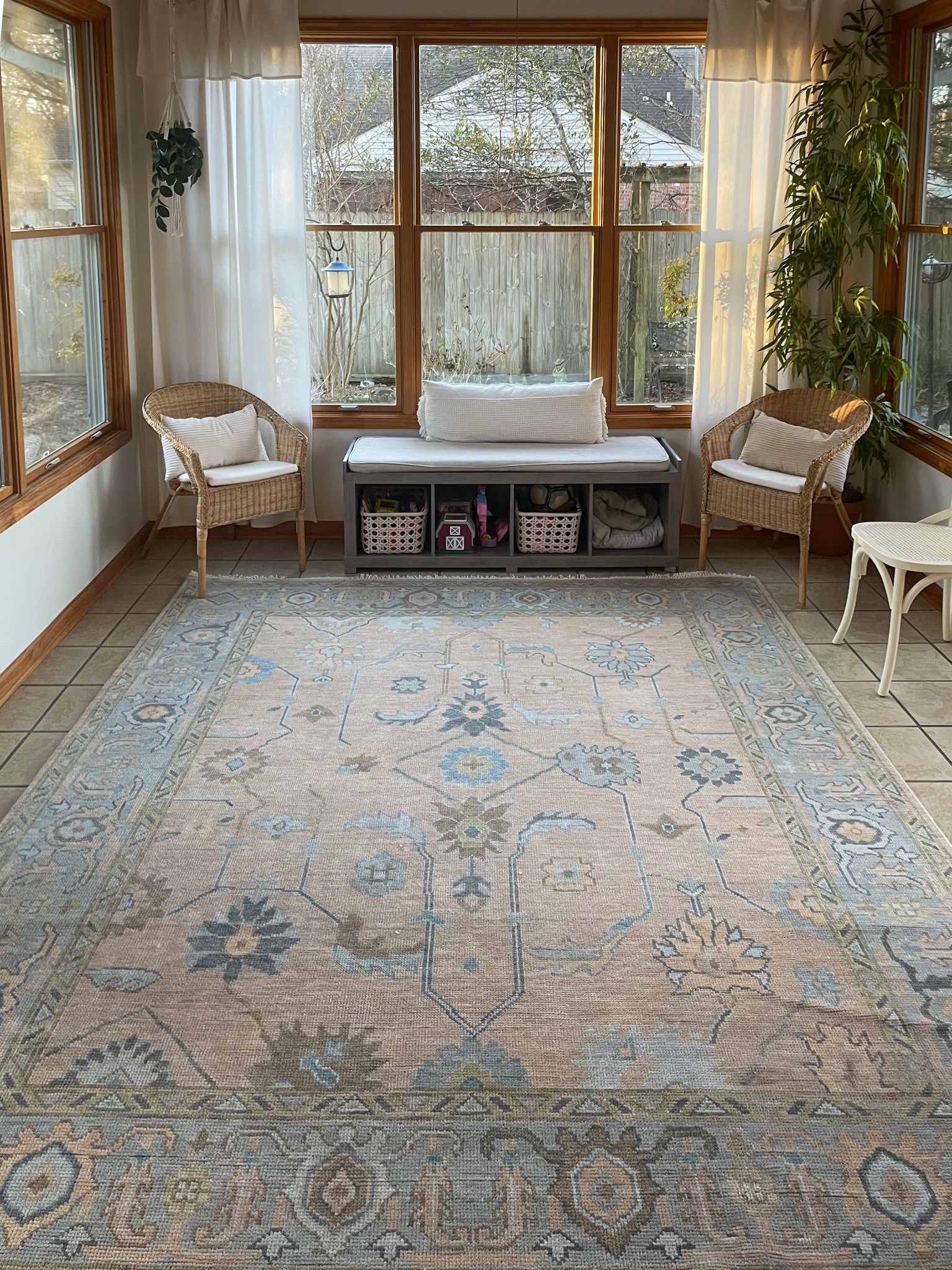 Sunroom decor
Modern oushak rug
Bench seating with cube storage 