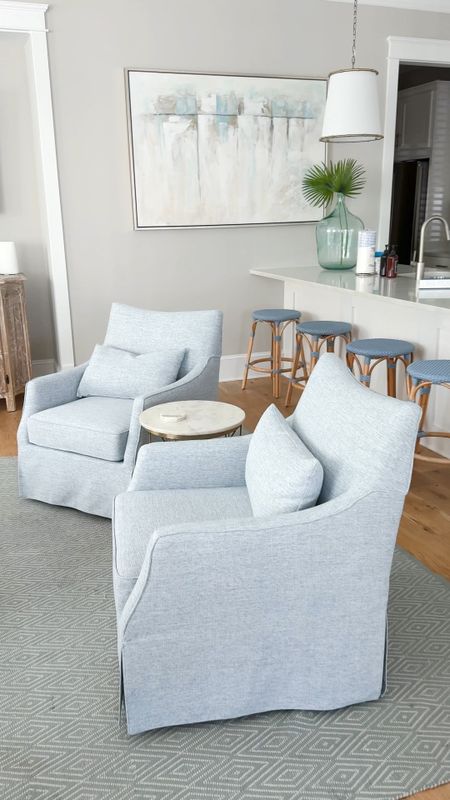 Loving these new swivel armchairs we bought for Hola Beaches, our beach house rental! They’re fairly affordable and are the prettiest blue gray fabric. Also linking our indoor/outdoor rug, blue counter stools and kitchen pendant lights.
.
#ltkhome #ltksalealert #ltkstyletip #ltkseasonal #ltkfindsunder100 #ltkfindsunder50 #ltksalealert coastal decor, coastal living room ideas #ltkvideo

#LTKSeasonal #LTKhome #LTKsalealert