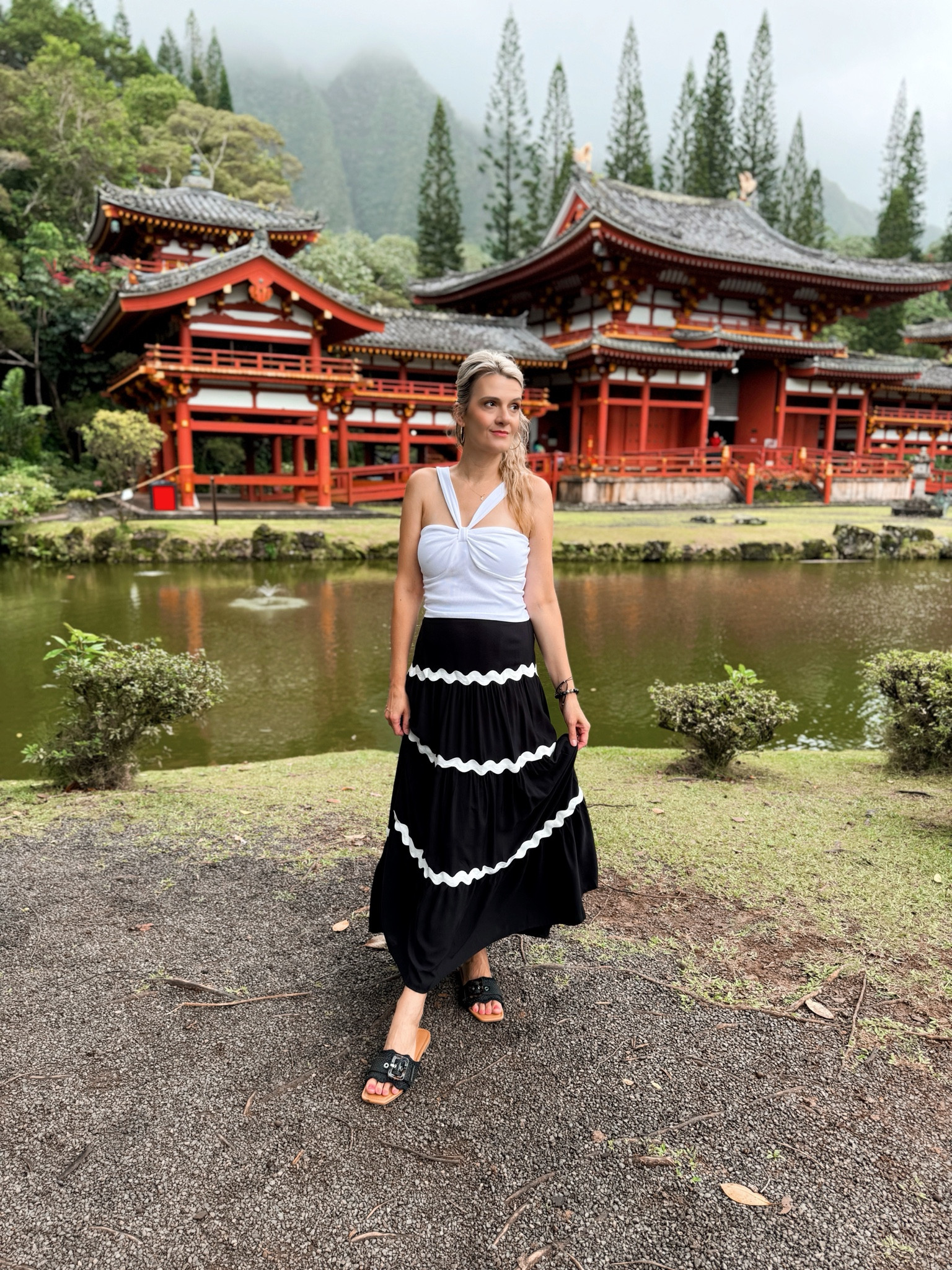 There’s no competing with the breathtaking backdrop of the Byodo-In Temple—its iconic red structure and lush greenery make every photo pop! 🌺 But it still felt amazing to match the peaceful elegance of this place with a simple yet chic look. My black skirt and white top were the perfect pair against the vibrant surroundings. 🖤🤍

Sometimes it’s not about outshining the beauty around you, but about feeling confident and radiant within it. 🌿👗



#LTKOver40 #LTKStyleTip #LTKTravel