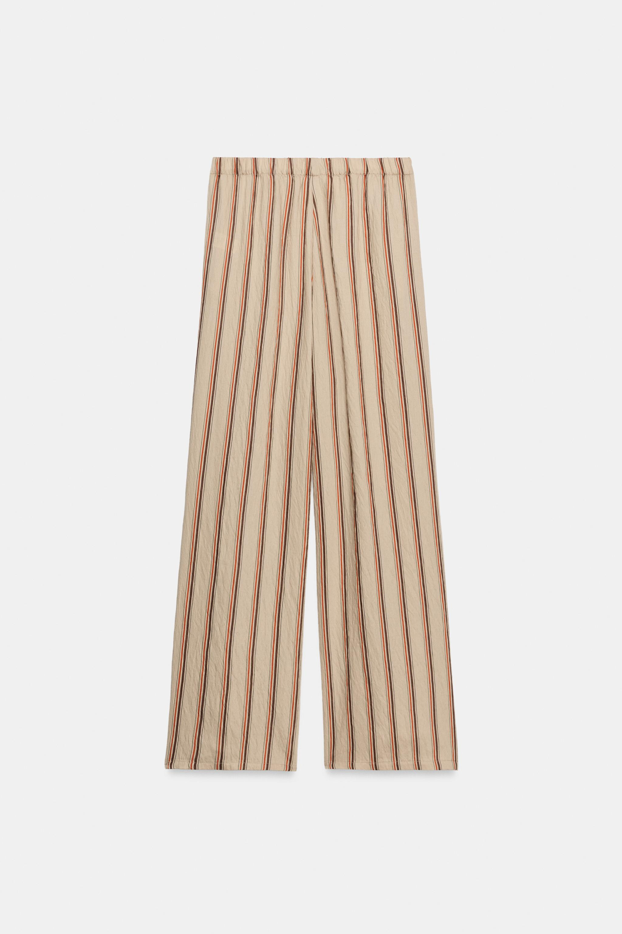 Model height: 181 cmMid-waist trousers with an elastic waistband. Featuring side pockets. | Zara UK