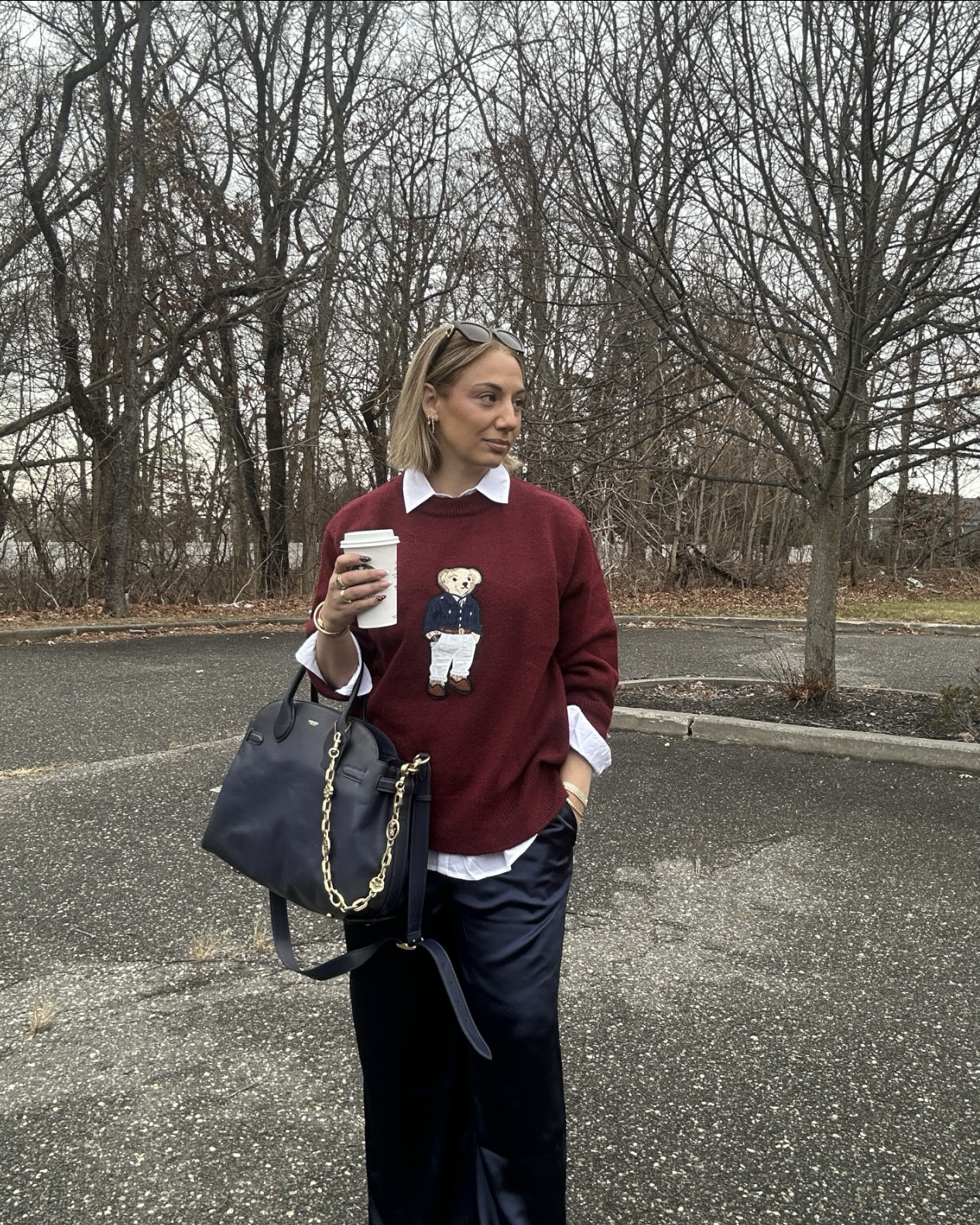 bear sweater layered with white button down shirt and satin pants from Loft 

#LTKMidsize #LTKWorkwear #LTKOver40