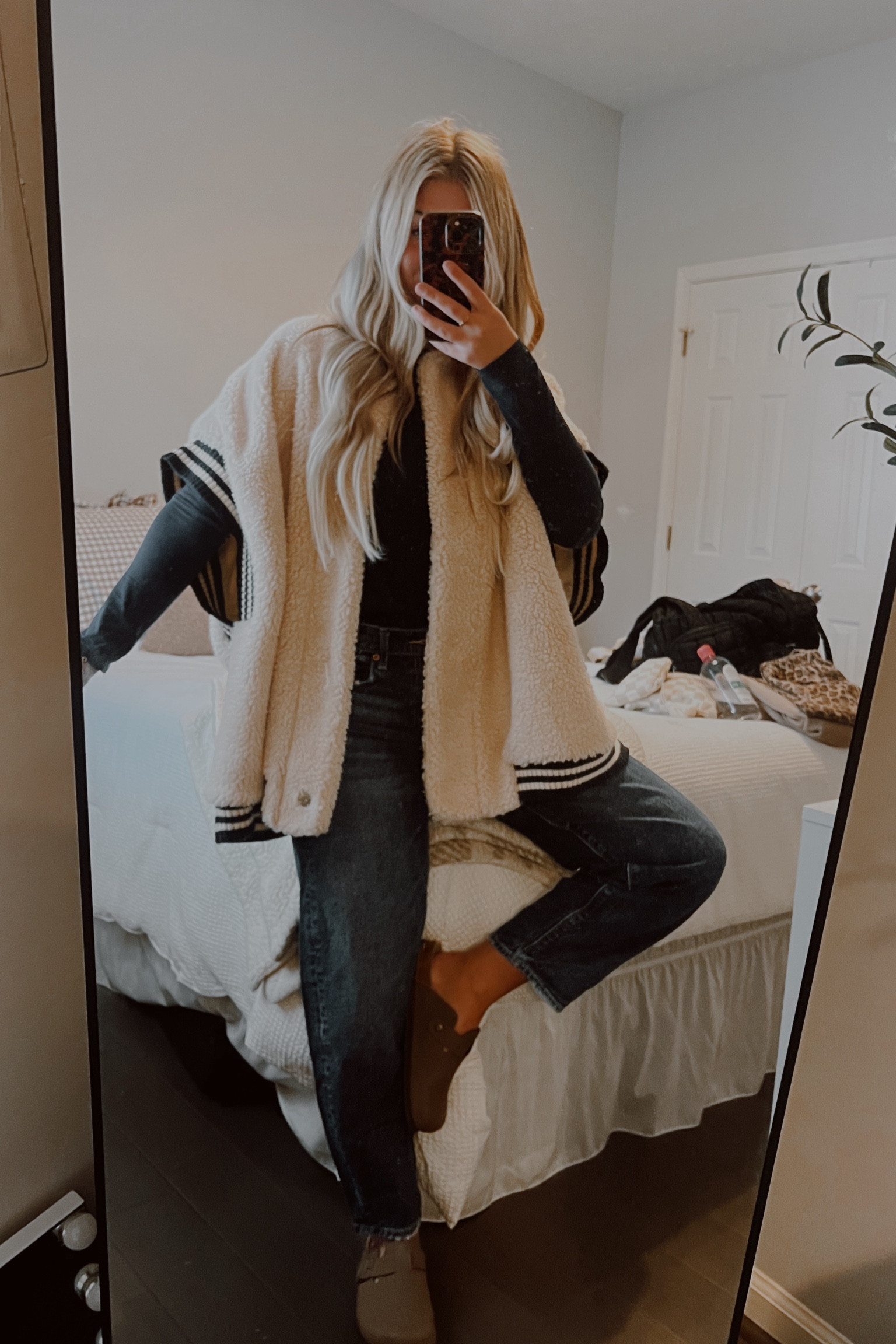 A vest over a navy blue shirt creates a sophisticated look, while dark-washed barreled jeans add a modern, relaxed touch. The combination is both stylish and comfortable, perfect for a casual vibe! 

#LTKPetite #LTKMostLoved #LTKSeasonal