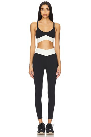 LSPACE Unmatched Sports Bra in Black & Cream from Revolve.com | Revolve Clothing (Global)