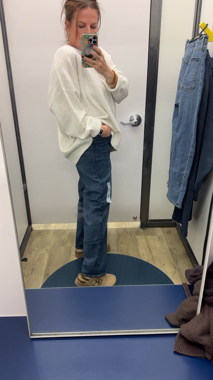 These jeans from Old Navy are so cute! They have a high-waisted loose fit, and they are currently 50% off. And this white sweater comes in a ton of colors. Get your normal size  

#LTKSeasonal #LTKMidsize #LTKSaleAlert