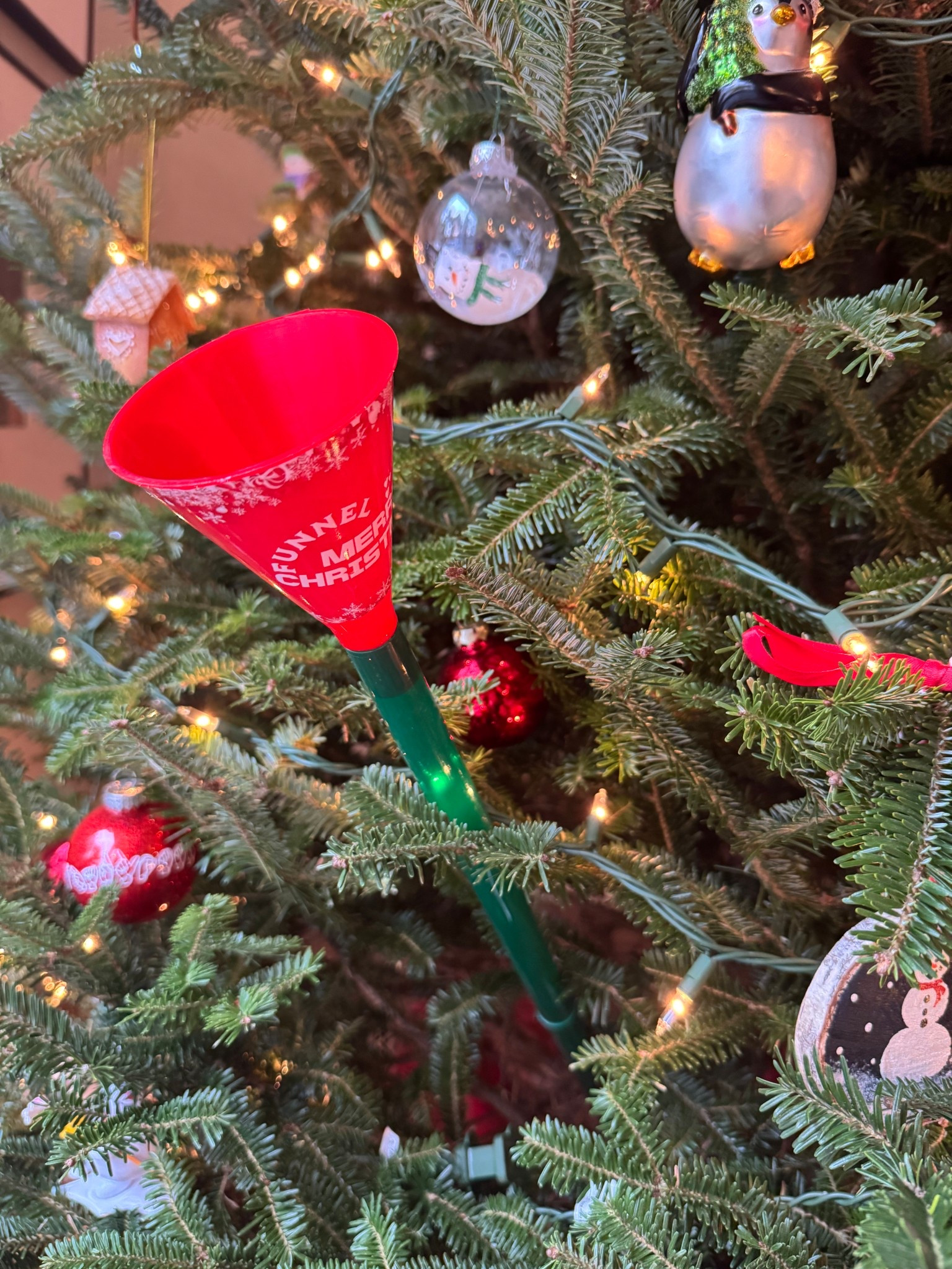 Easiest way to water a tree! 
Watering elf 
Watering a Christmas treee