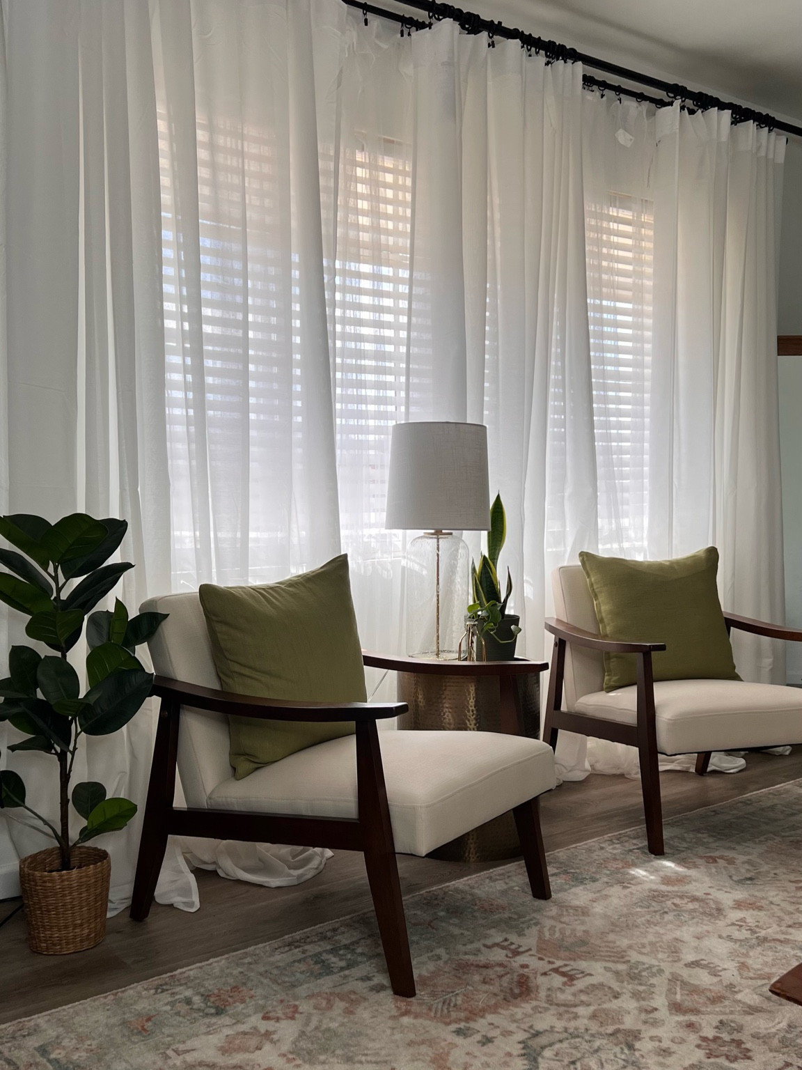 The perfect entertaining space. These chairs are so comfortable and affordable. They are styled with IKEA pillow cases on top of thrifted pillows. The green pillows play so well with the blue-ish green accents in the Kai rug. All perfectly brought together with the gold accent table and bubble lamp 
 

#LTKunder50 #LTKFind #LTKhome